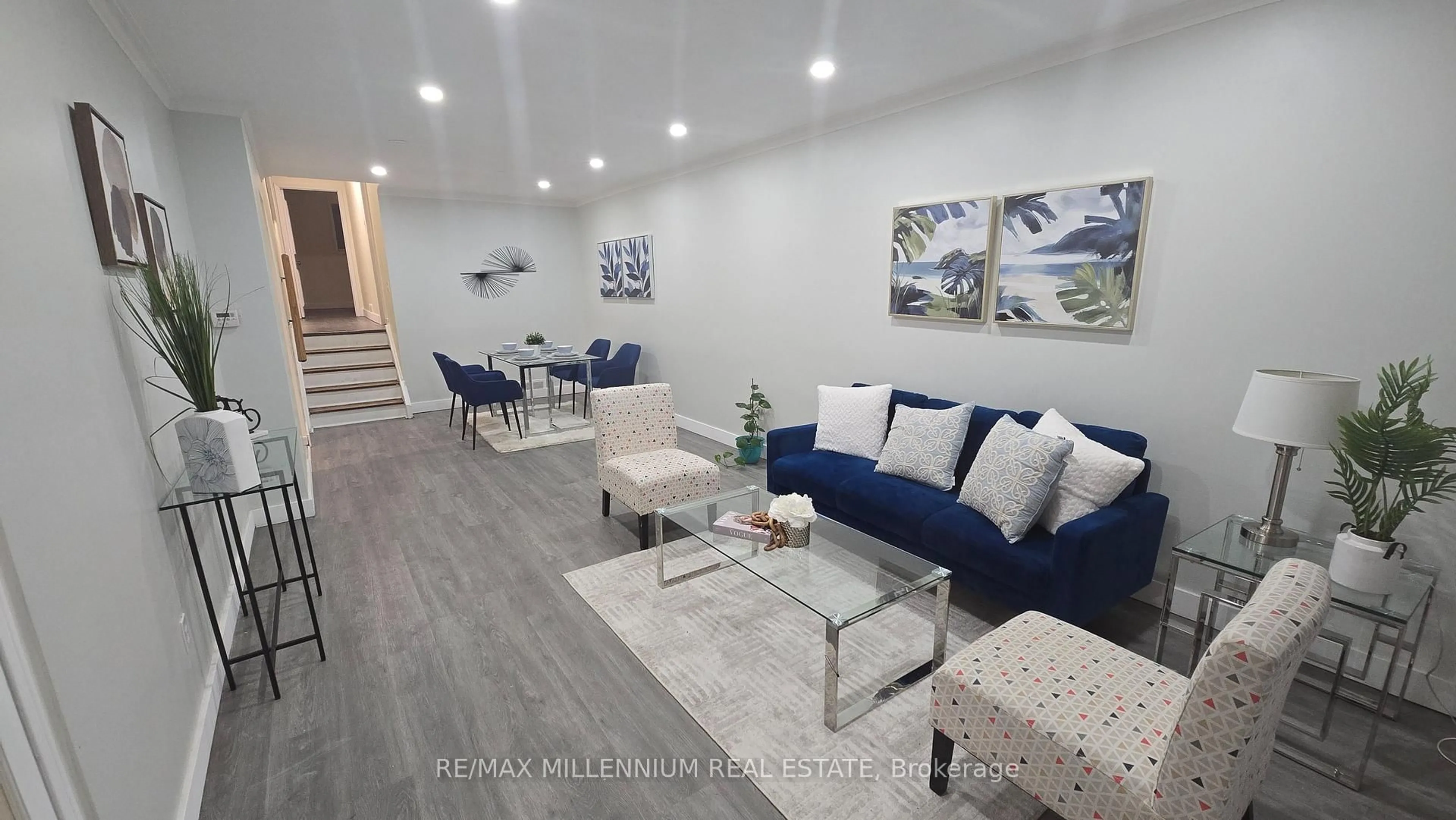 Living room with furniture, wood/laminate floor for 120 Duncanwoods Dr, Toronto Ontario M9L 2E1