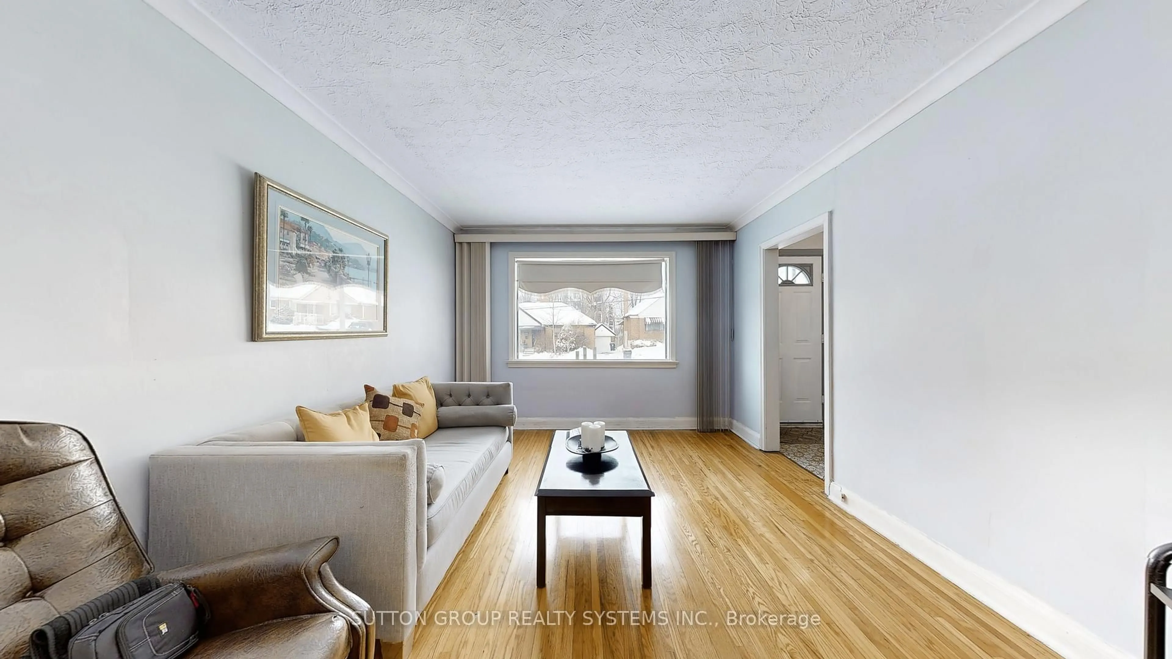 Living room with furniture, wood/laminate floor for 199 Strathnairn Ave, Toronto Ontario M6M 2G6