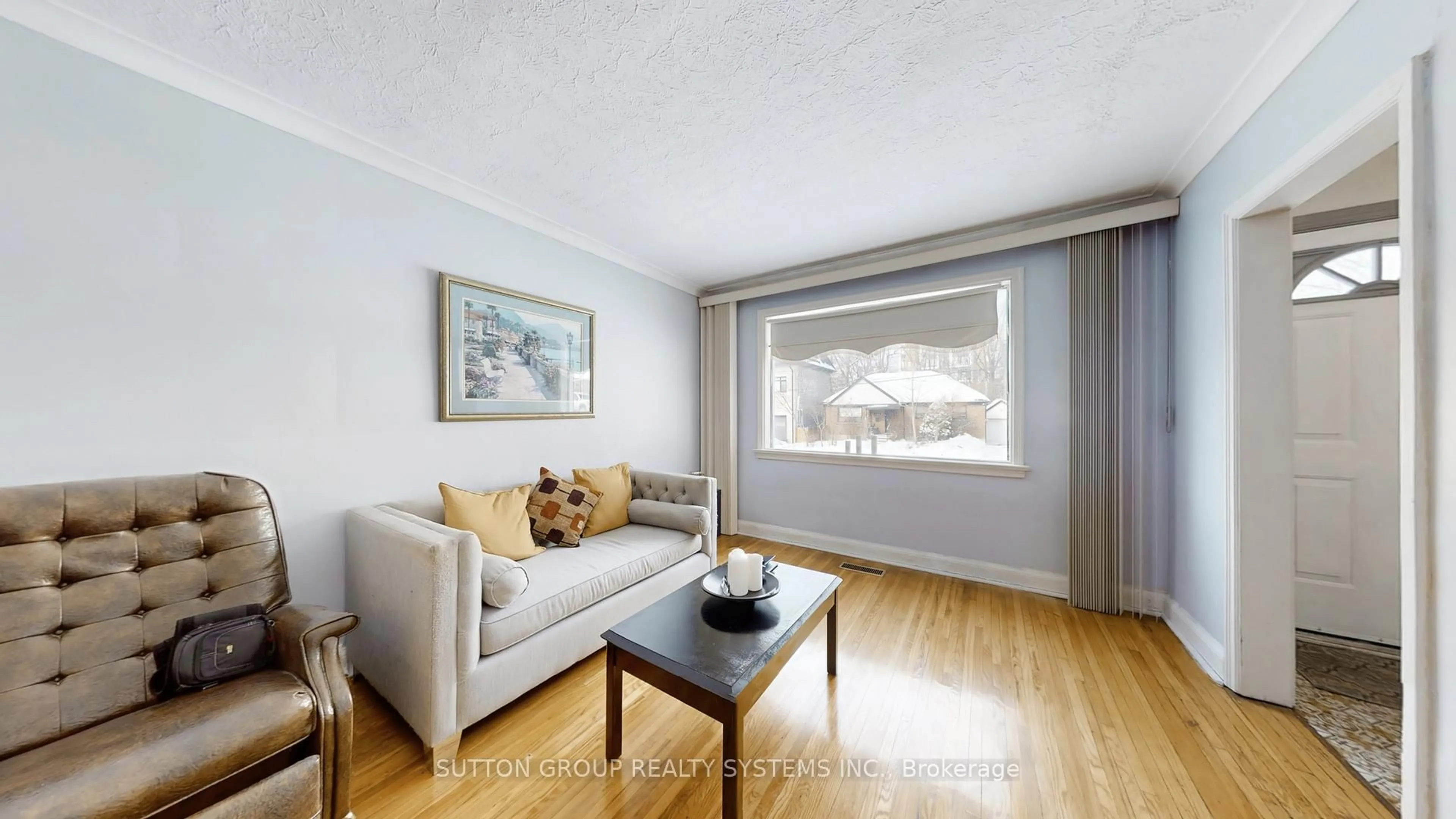 Living room with furniture, wood/laminate floor for 199 Strathnairn Ave, Toronto Ontario M6M 2G6