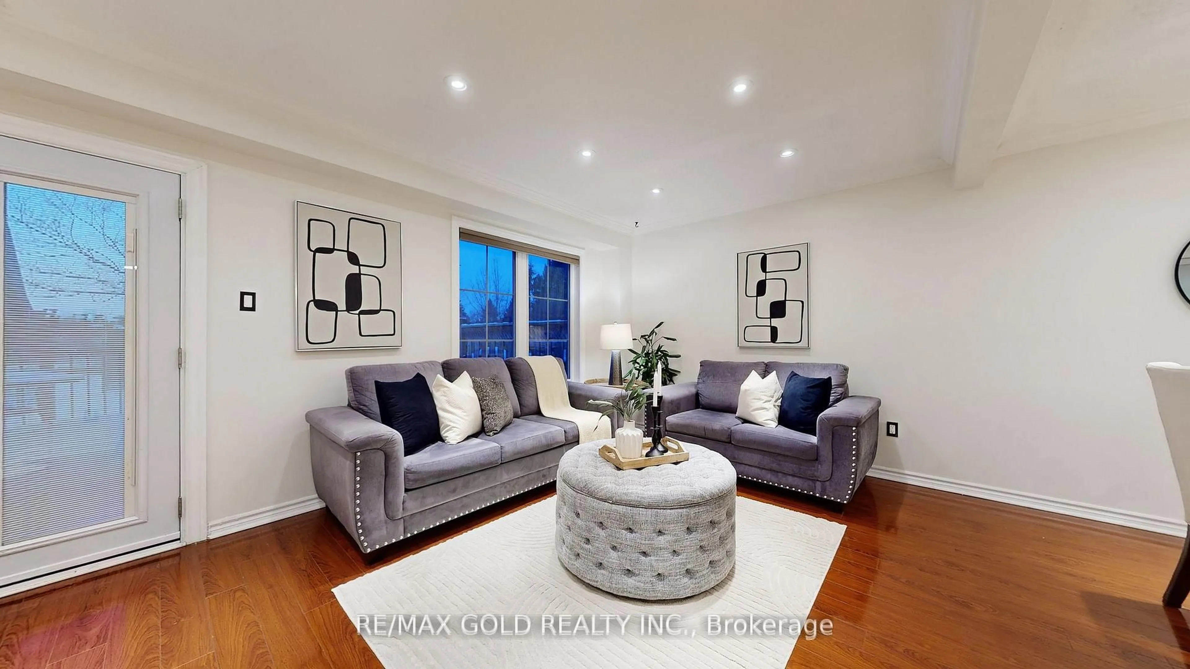 Living room with furniture, wood/laminate floor for 156 Royal Salisbury Way, Brampton Ontario L6V 3J9