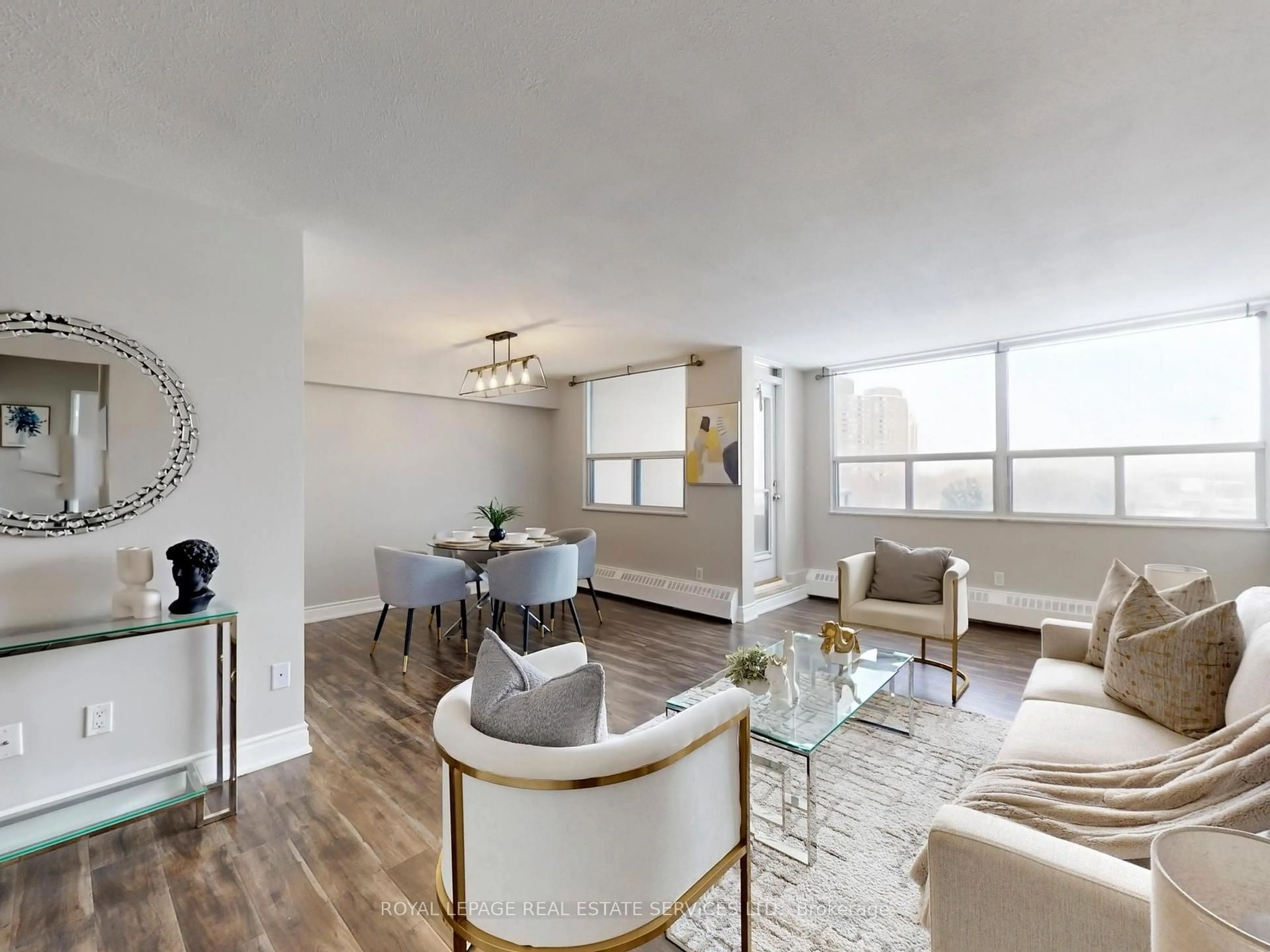 Living room with furniture, wood/laminate floor for 551 The West Mall #702, Toronto Ontario M9C 1G7