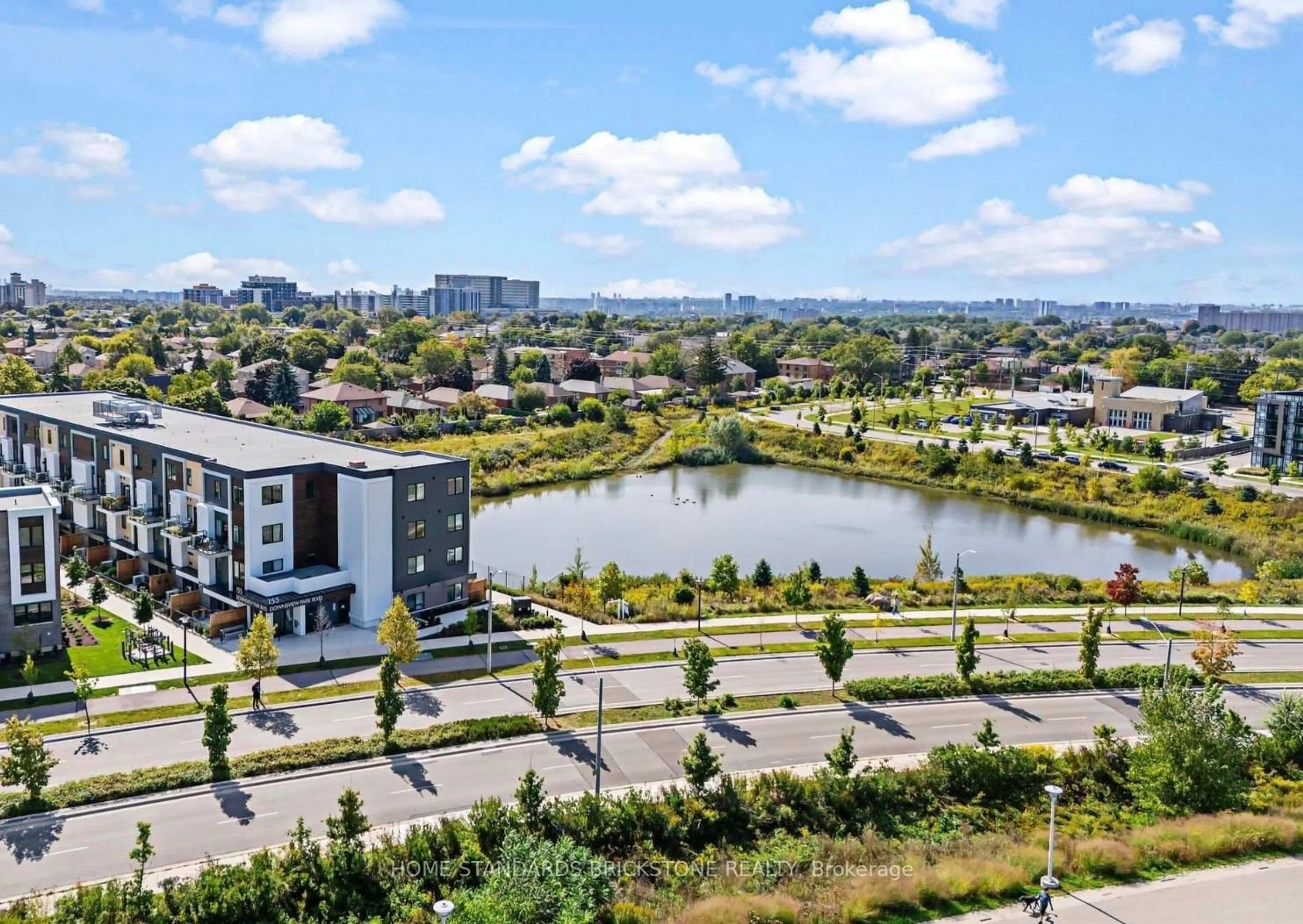 A pic from outside/outdoor area/front of a property/back of a property/a pic from drone, water/lake/river/ocean view for 155 Downsview Park Blvd #207, Toronto Ontario M3K 0E3