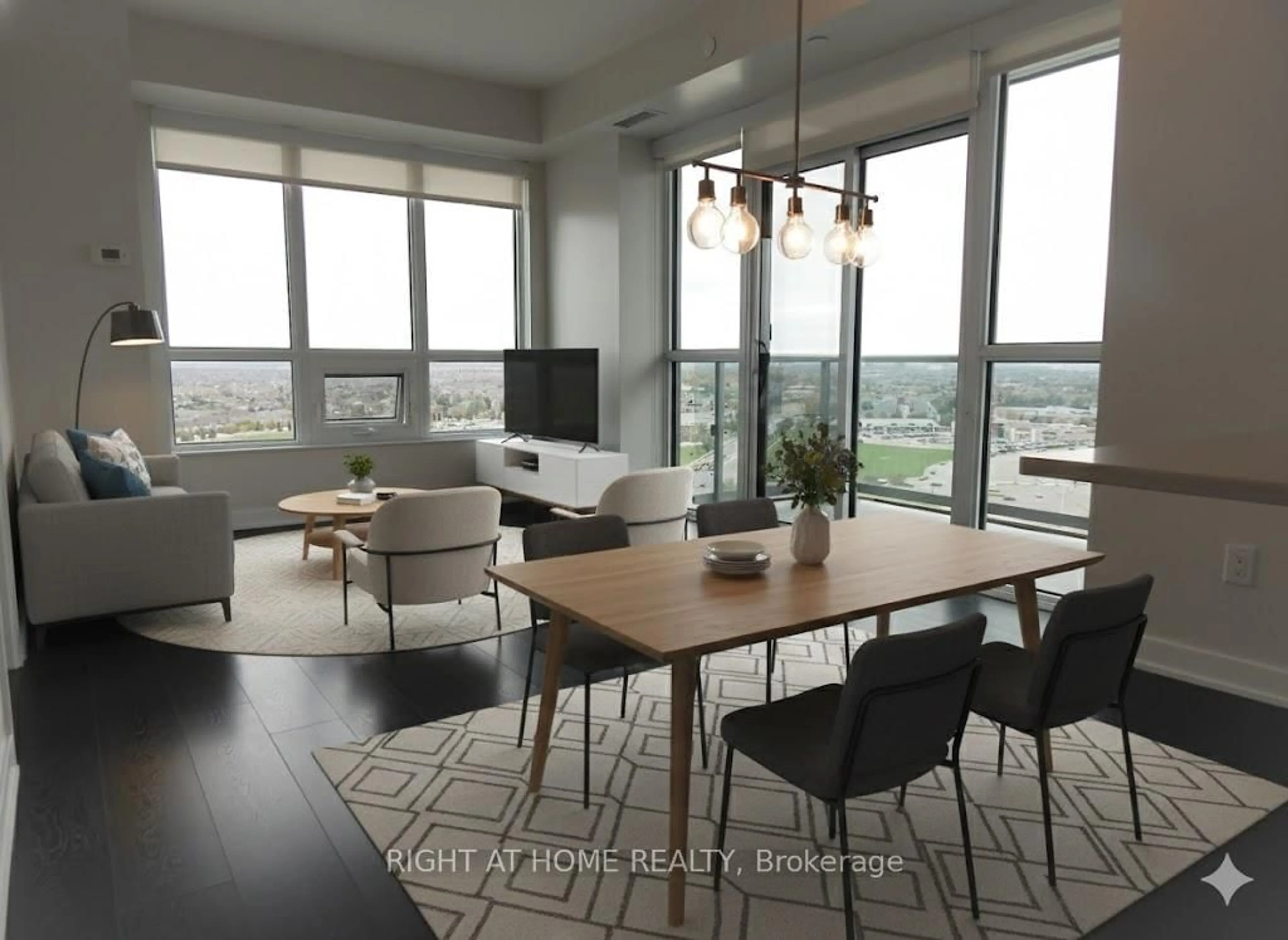 Living room with furniture, wood/laminate floor for 4633 Glen Erin Dr #1803, Mississauga Ontario L5M 0Y6