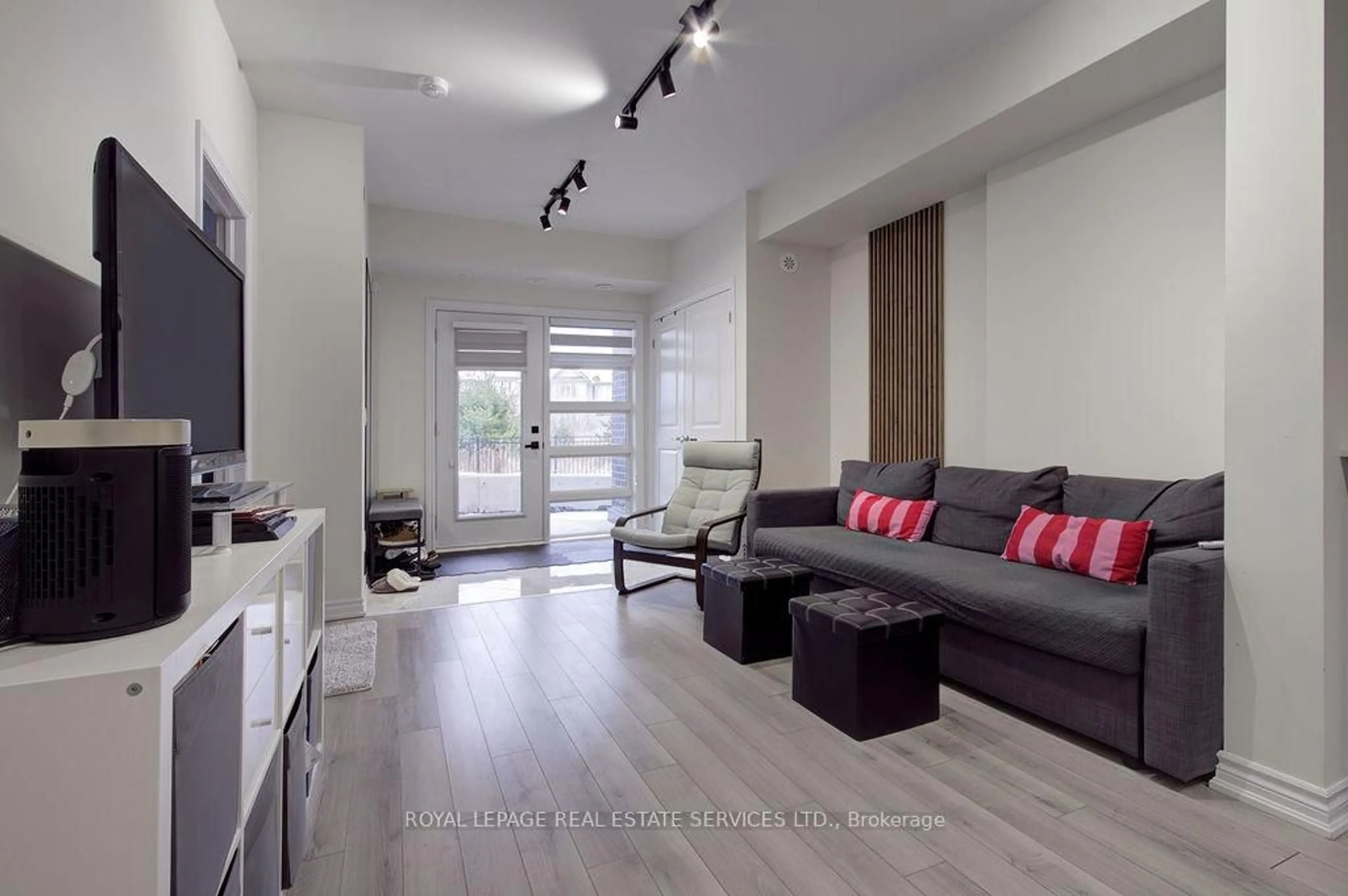 Living room with furniture, wood/laminate floor for 349 Wheat Boom Dr #123, Oakville Ontario L6H 7X5