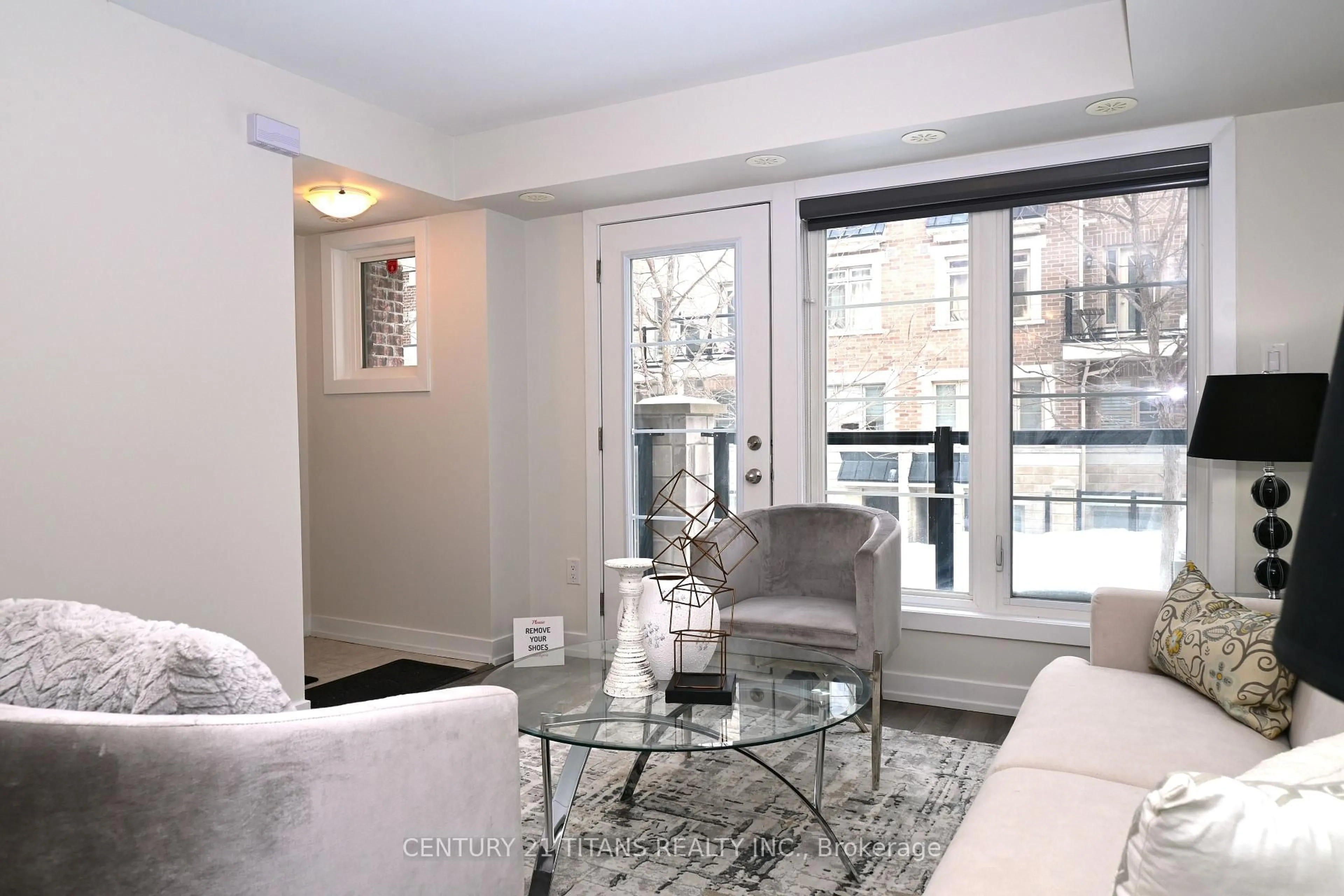 Living room with furniture, unknown for 80 Parrotta Dr #135, Toronto Ontario M9M 0E6