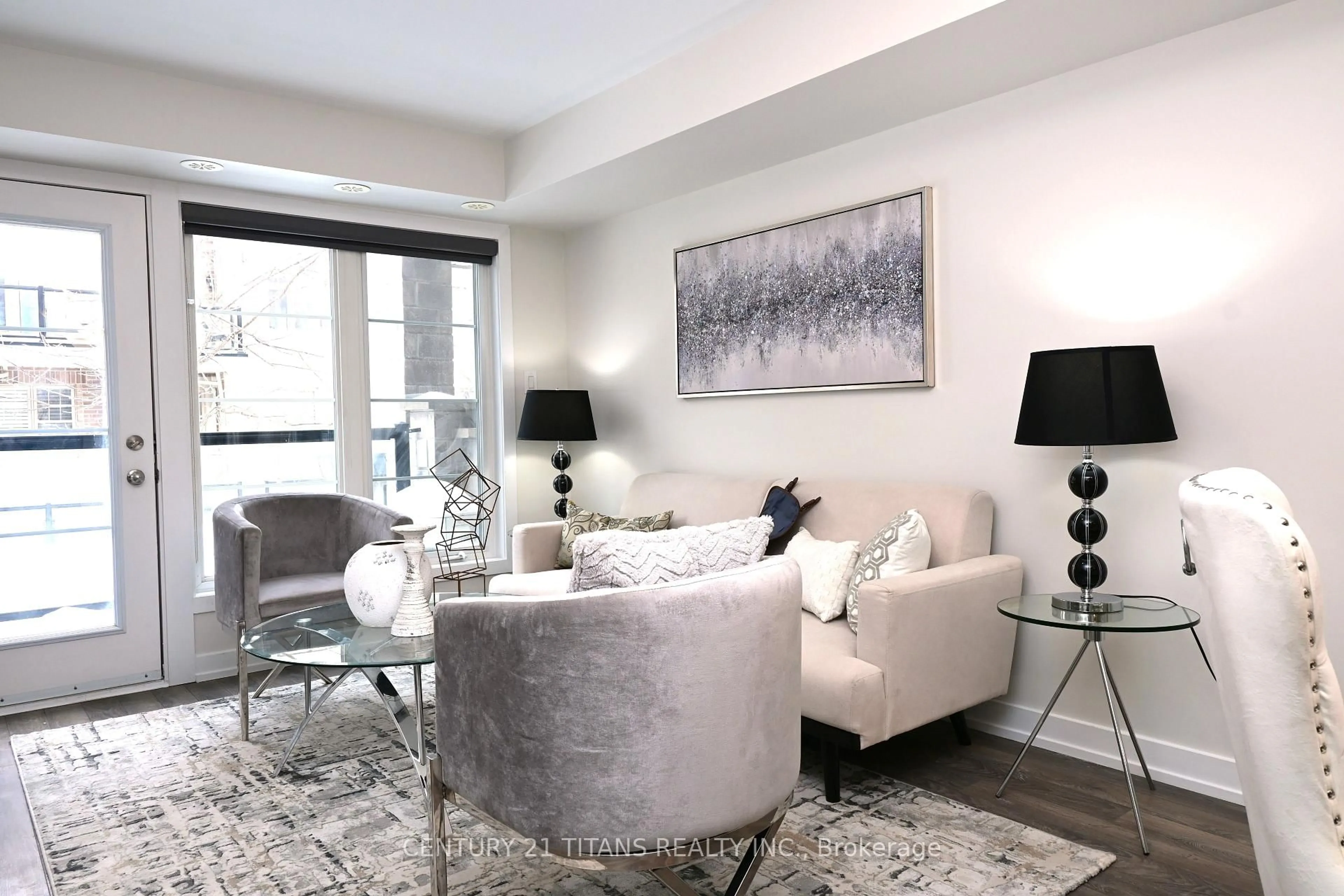 Living room with furniture, unknown for 80 Parrotta Dr #135, Toronto Ontario M9M 0E6