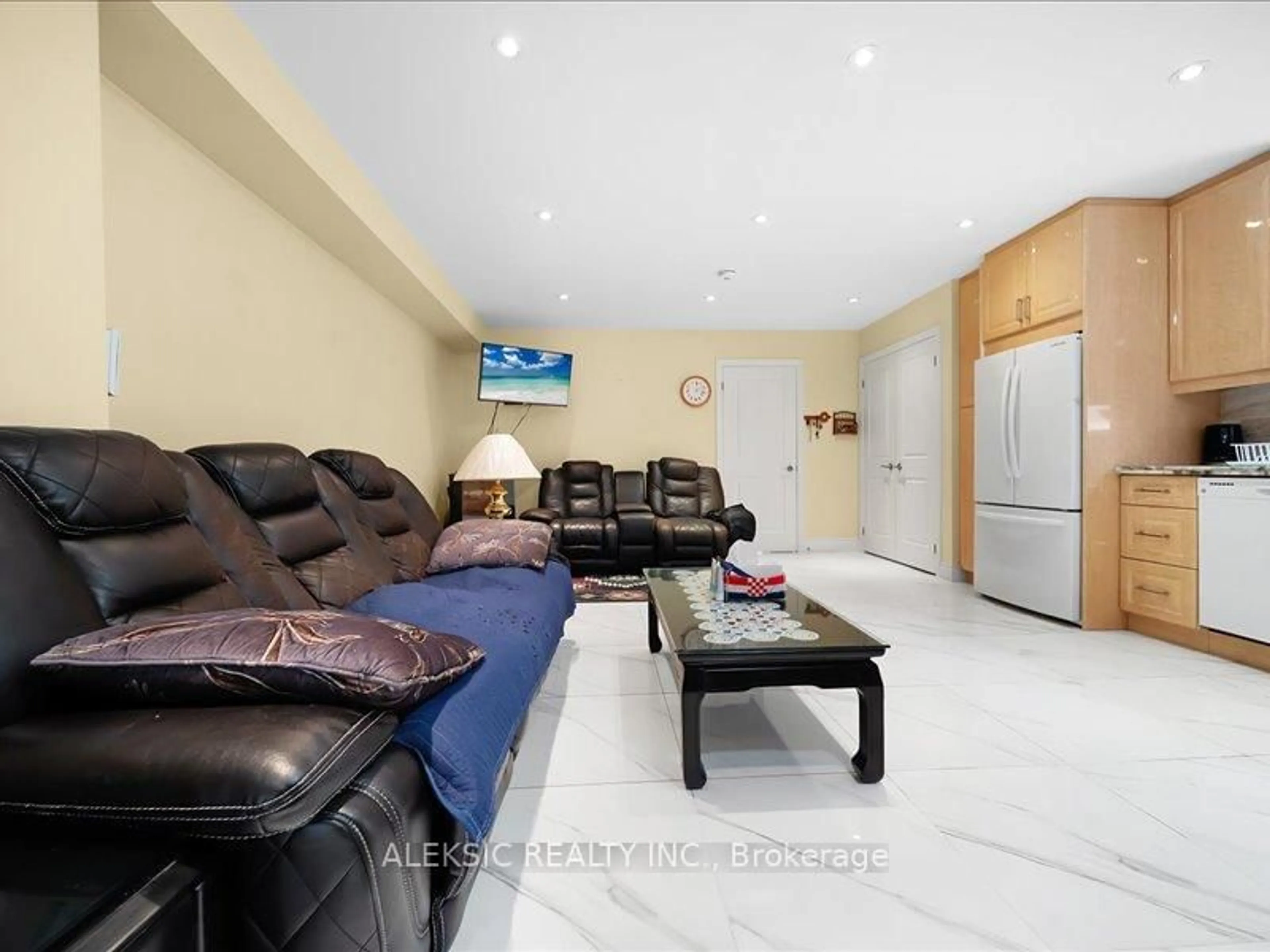 Living room with furniture, ceramic/tile floor for 132 Browns Line, Toronto Ontario M8W 3T2