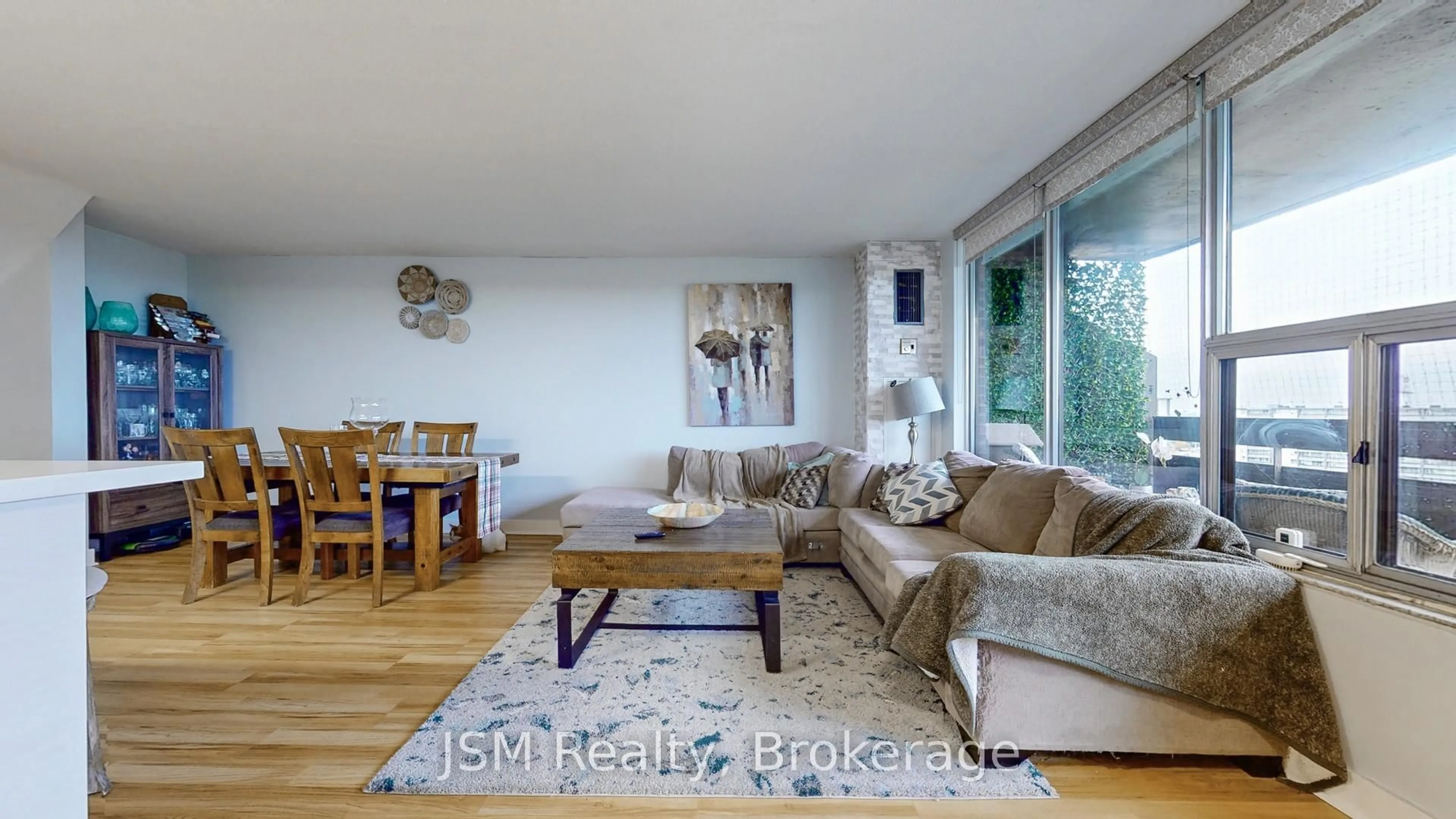 Living room with furniture, wood/laminate floor for 11 Wincott Dr #1912, Toronto Ontario M9R 2R9