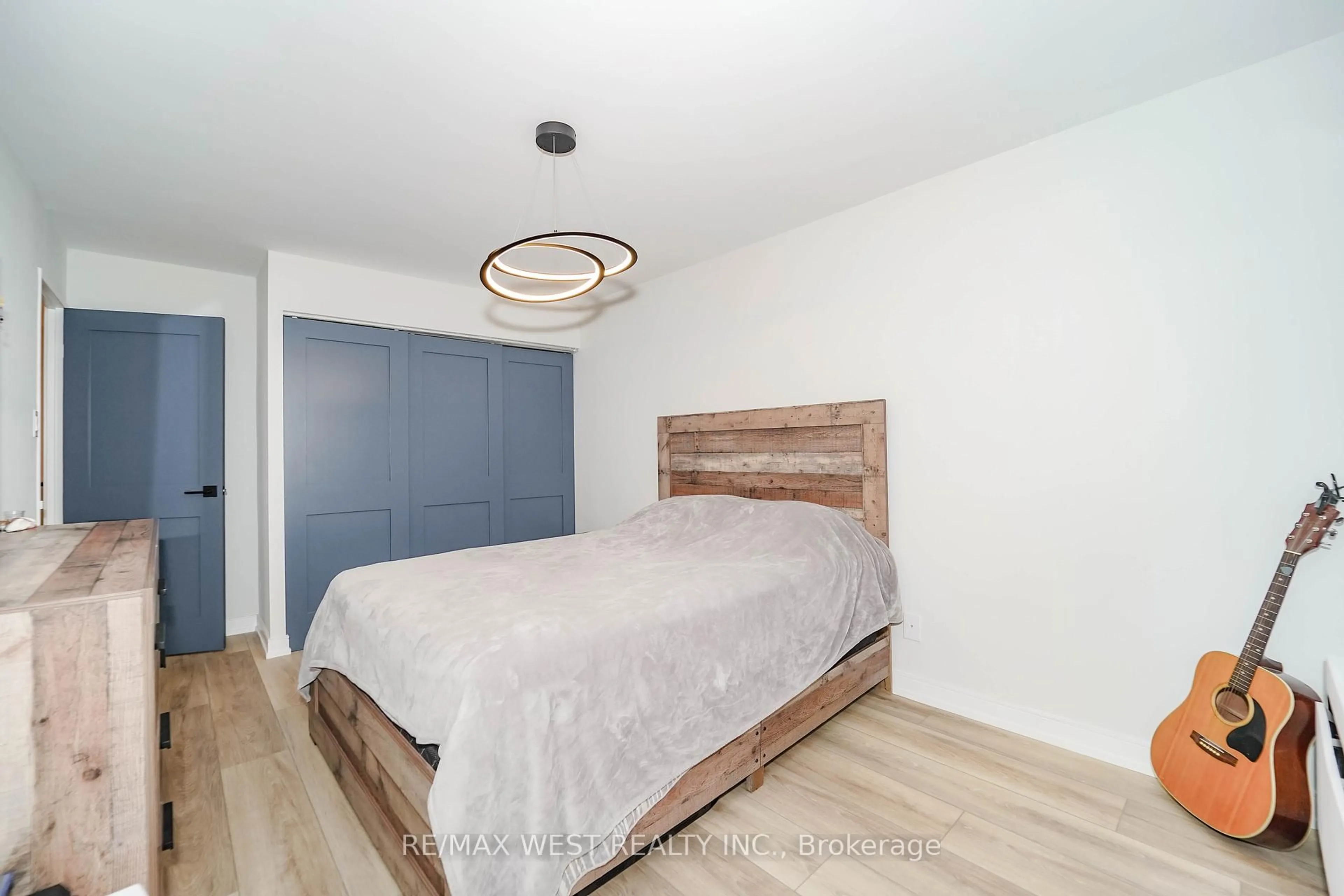 Bedroom with bed, wood/laminate floor for 300 Mill Rd #D14, Toronto Ontario M9C 4W9