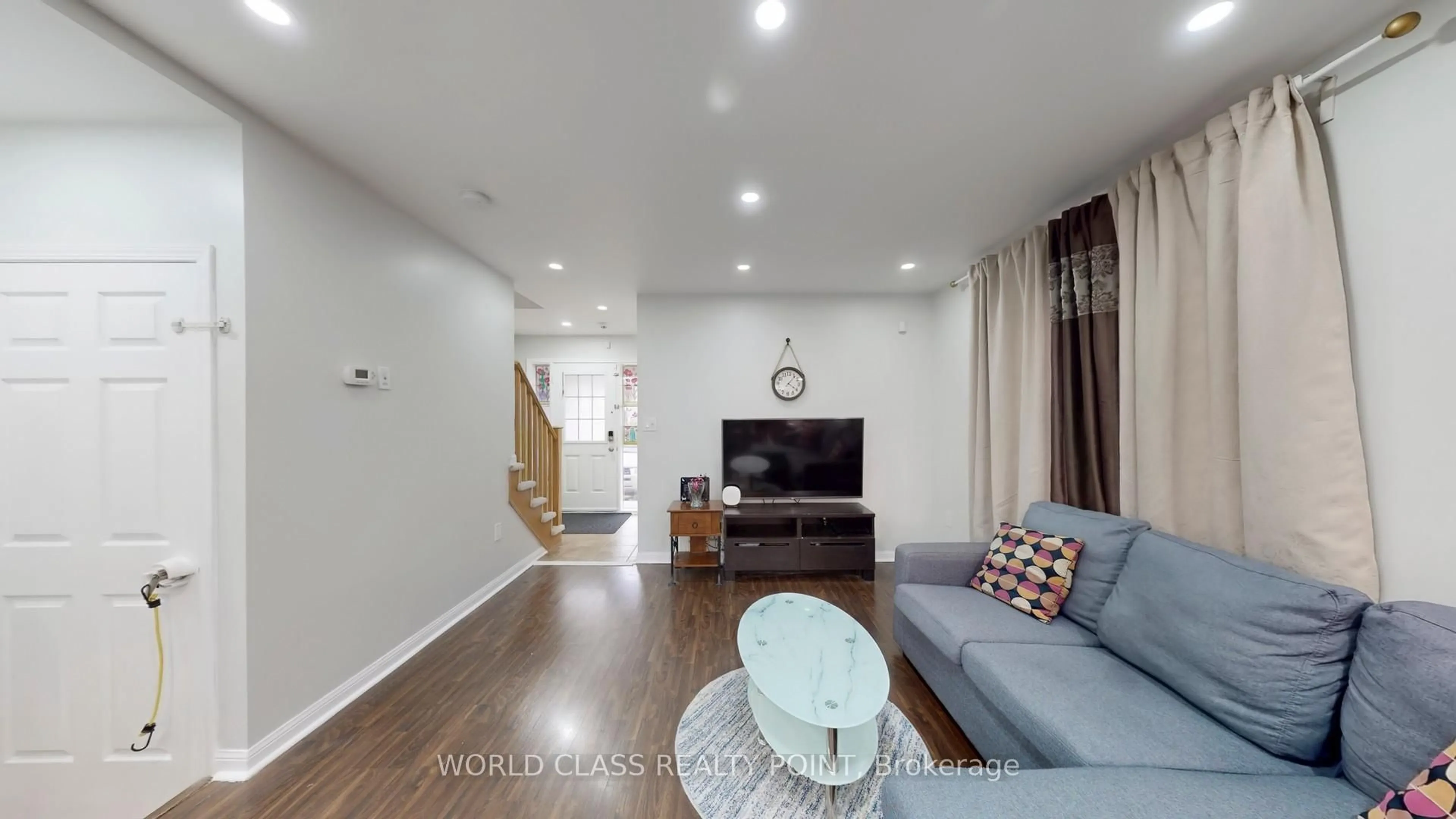 Living room with furniture, wood/laminate floor for 382 Pringle Ave, Milton Ontario L9T 7M4