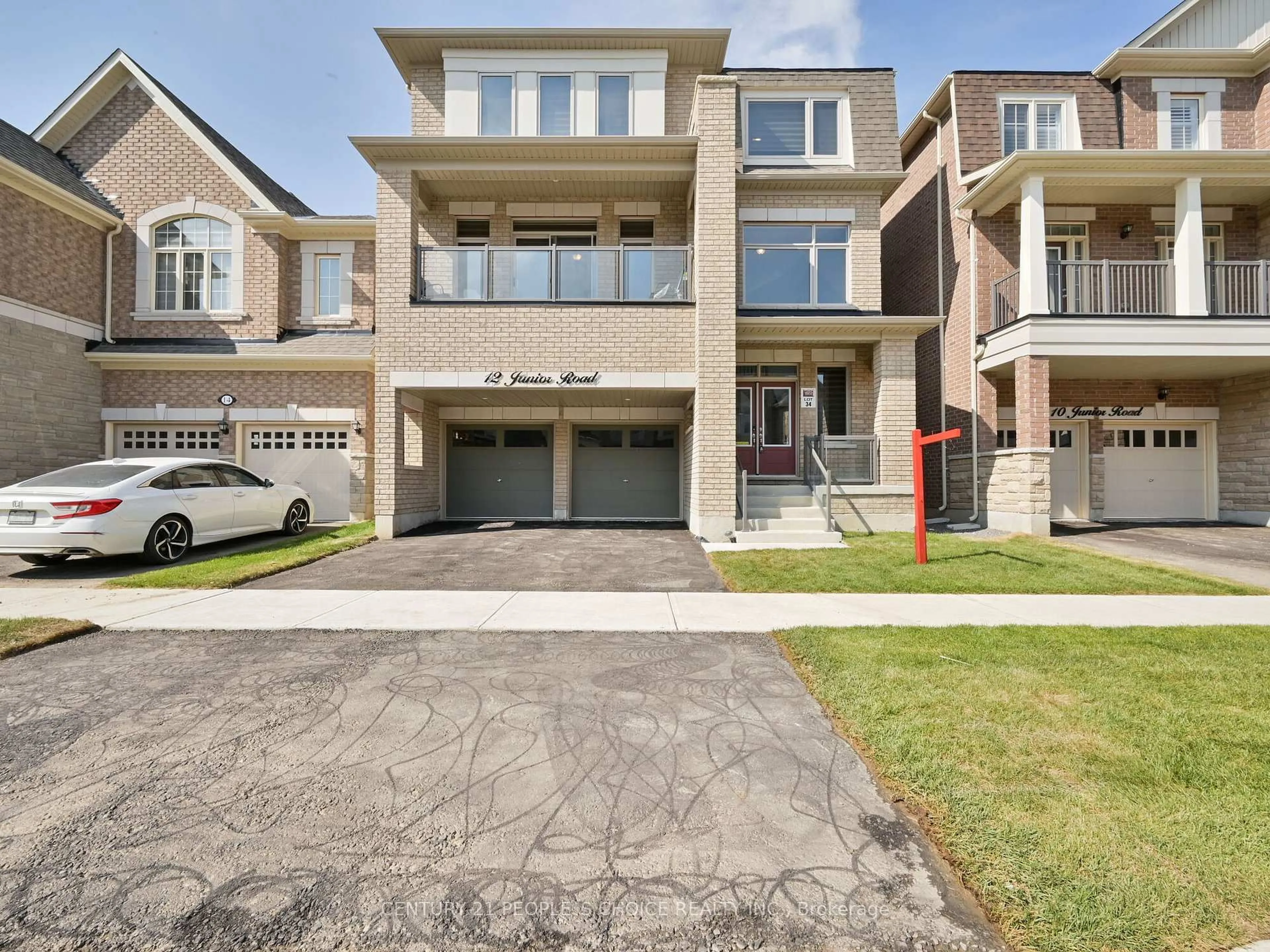 Home with brick exterior material, street for 12 Junior Rd, Brampton Ontario L7A 5J4