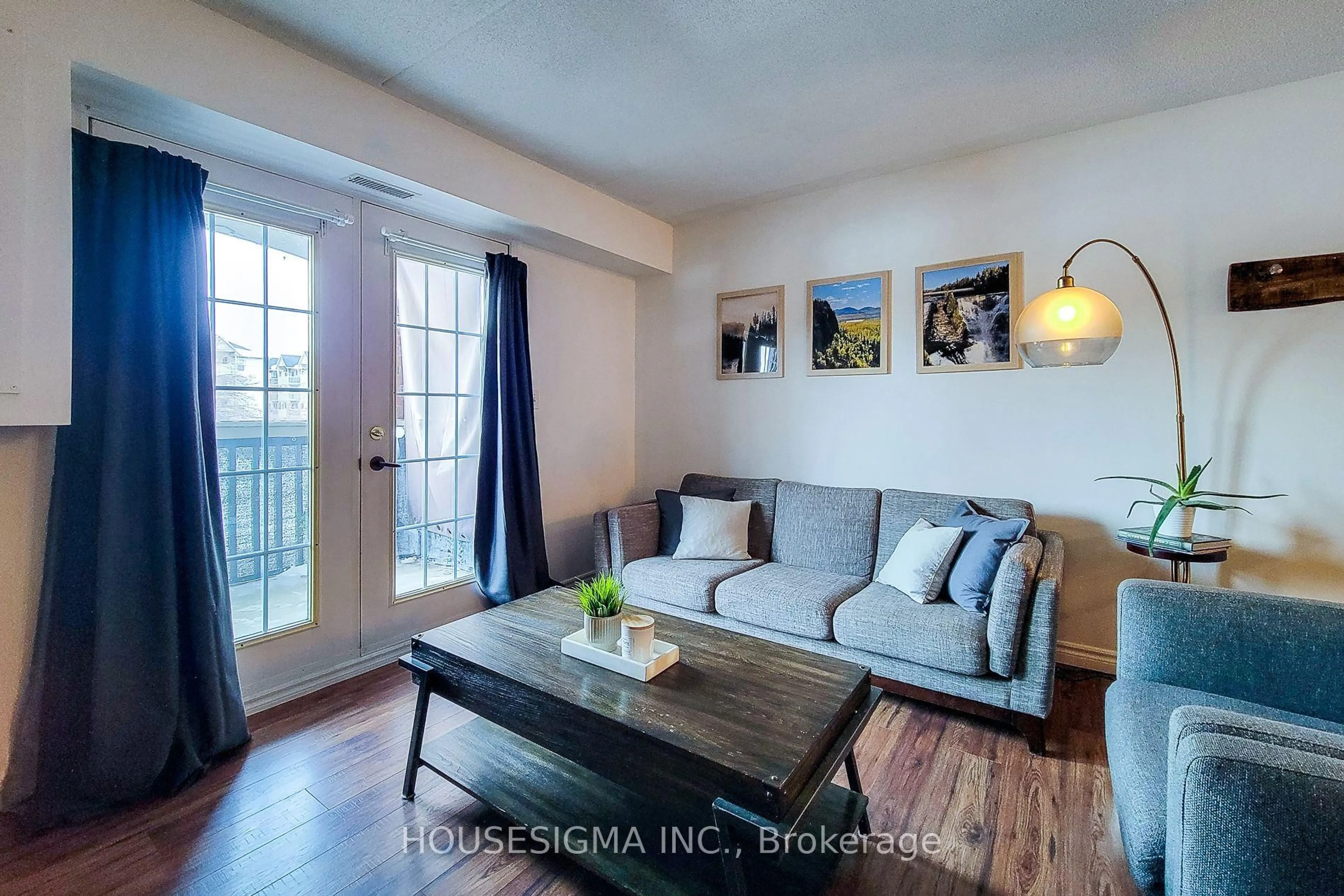 Living room with furniture, wood/laminate floor for 4003 Kilmer Dr #204, Burlington Ontario L7M 4M1