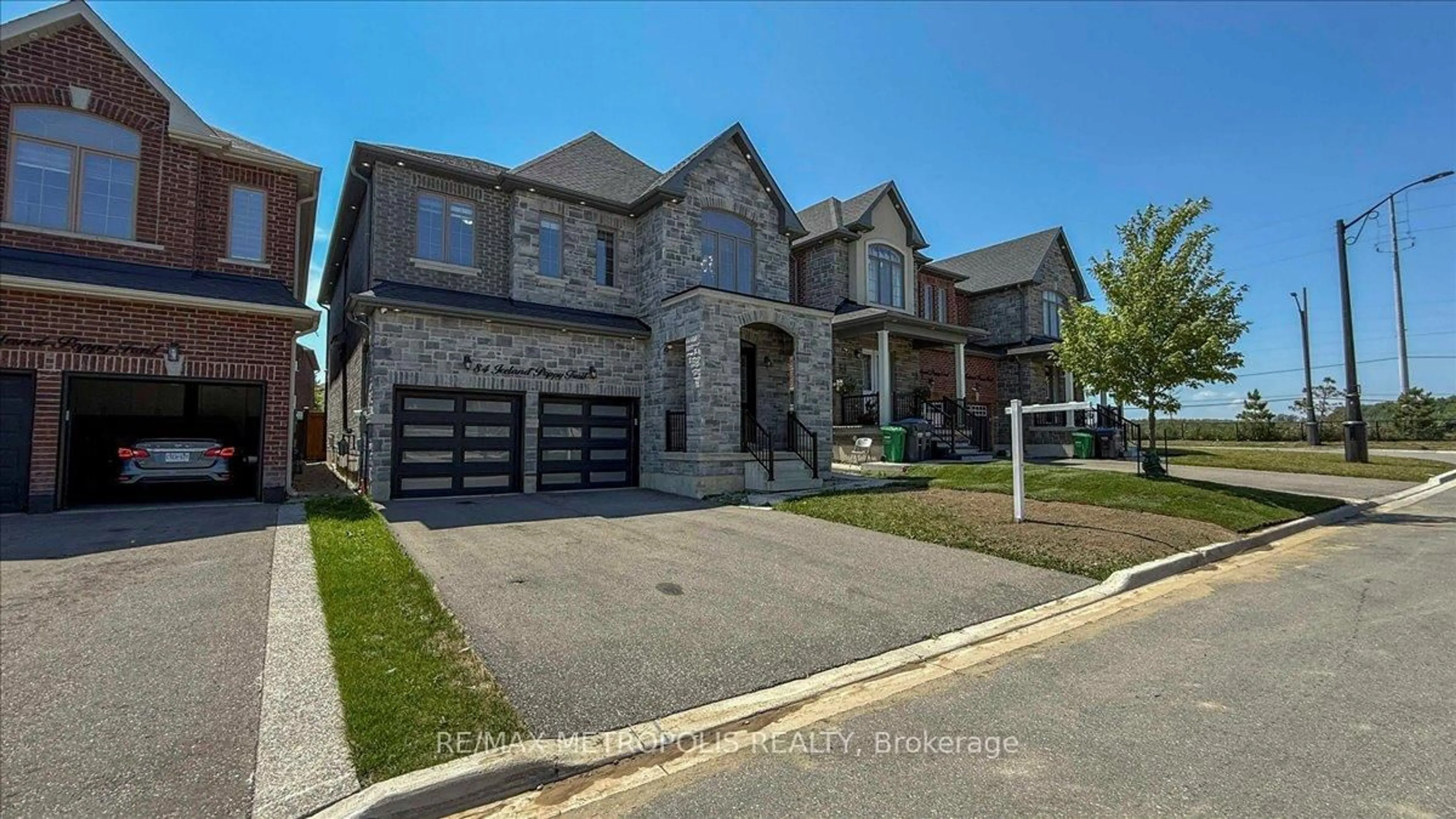 Home with brick exterior material, street for 84 Iceland Poppy Tr, Brampton Ontario L7A 0C1
