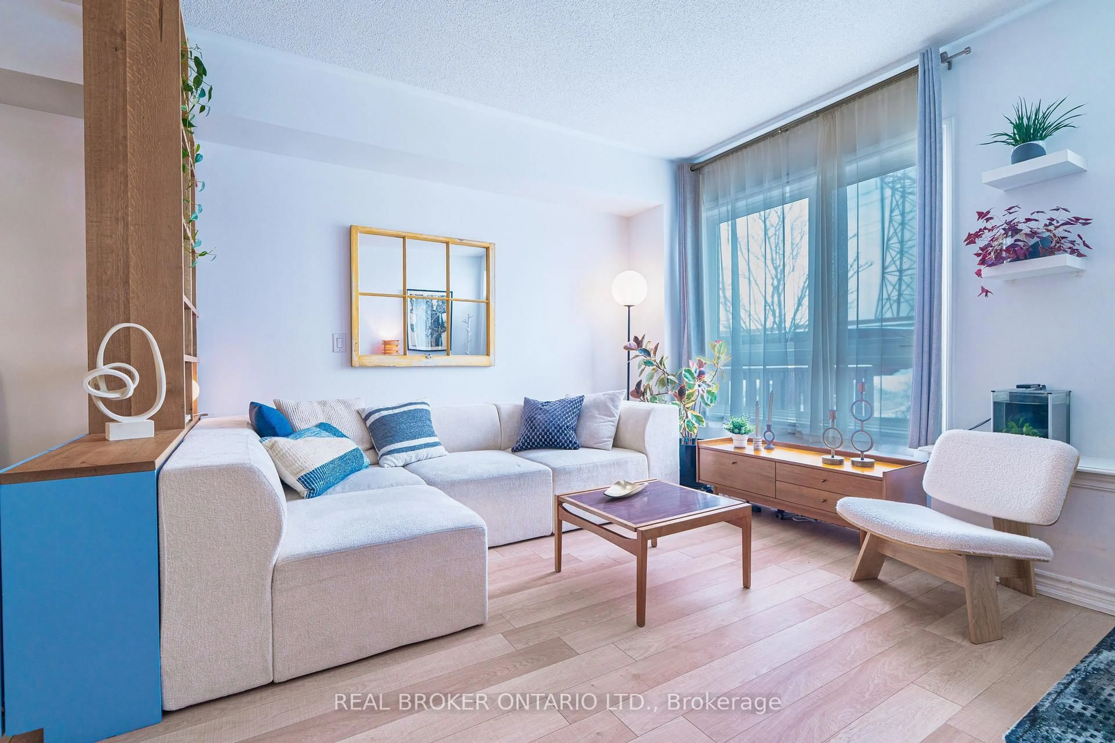 Living room with furniture, wood/laminate floor for 104 Caledonia Park Rd #2, Toronto Ontario M6H 0B1