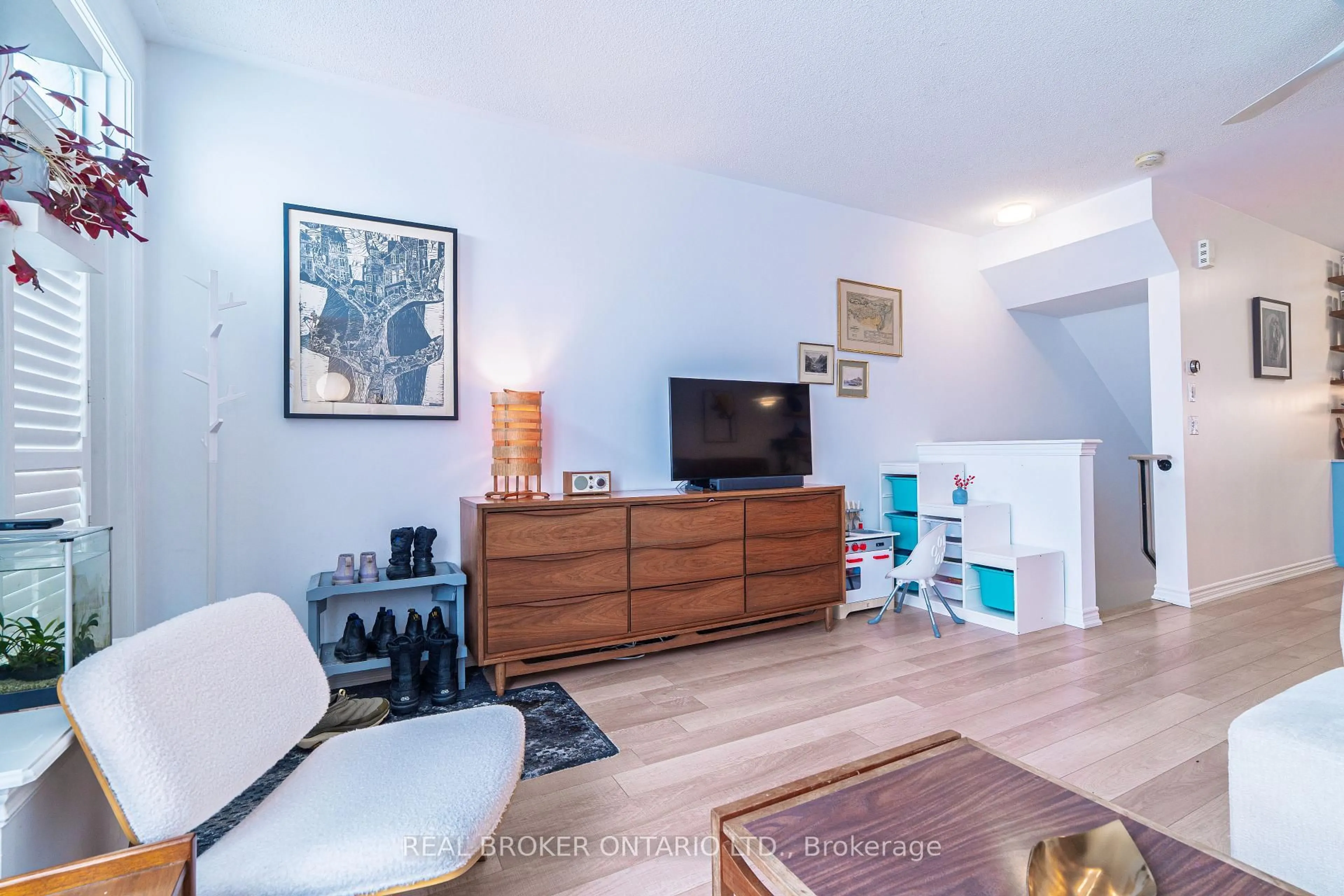 Living room with furniture, wood/laminate floor for 104 Caledonia Park Rd #2, Toronto Ontario M6H 0B1