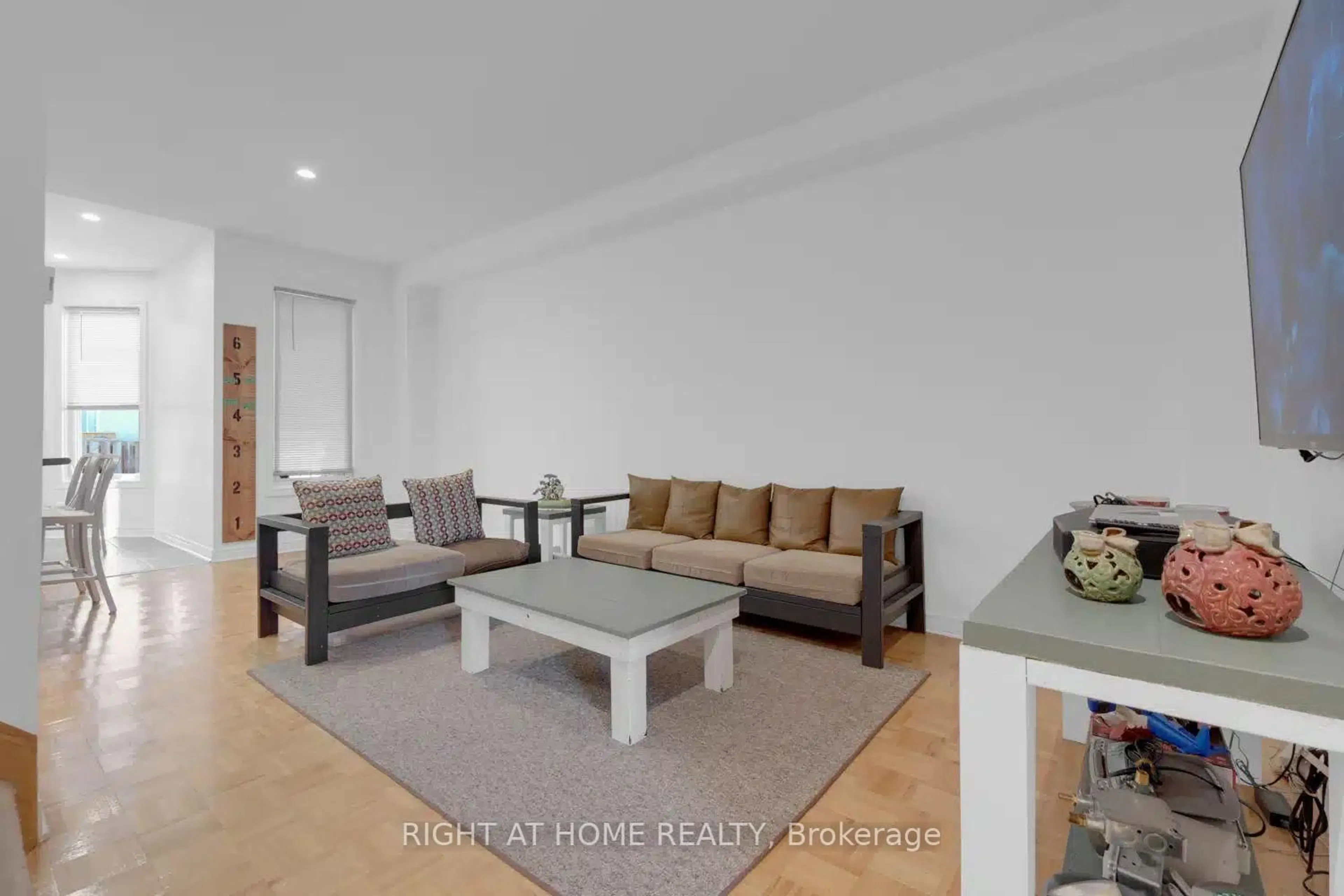 Living room with furniture, wood/laminate floor for 53 Silent Pond Cres, Brampton Ontario L6V 4S9