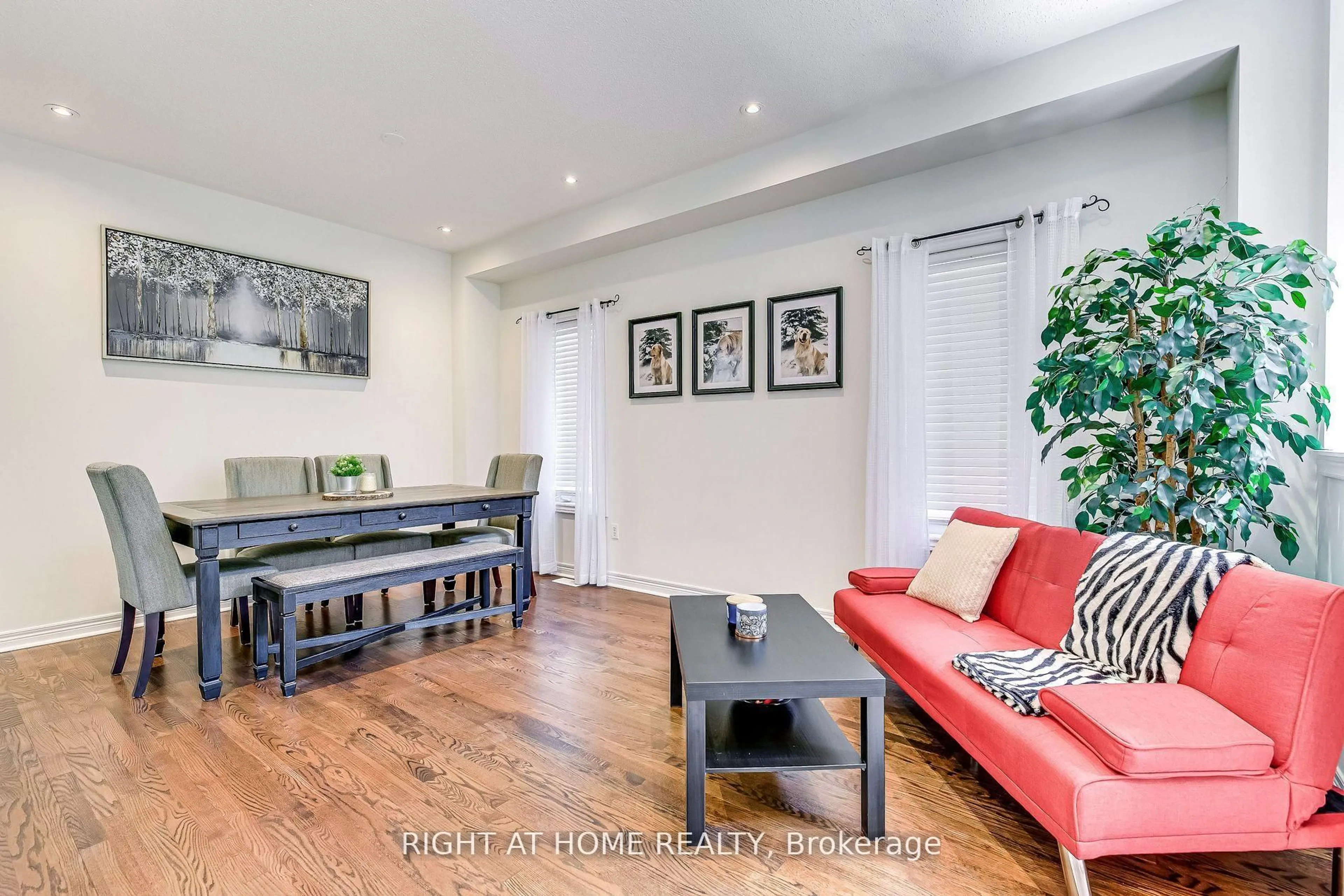 Living room with furniture, wood/laminate floor for 3228 Cabano Cres, Mississauga Ontario L5M 0B9