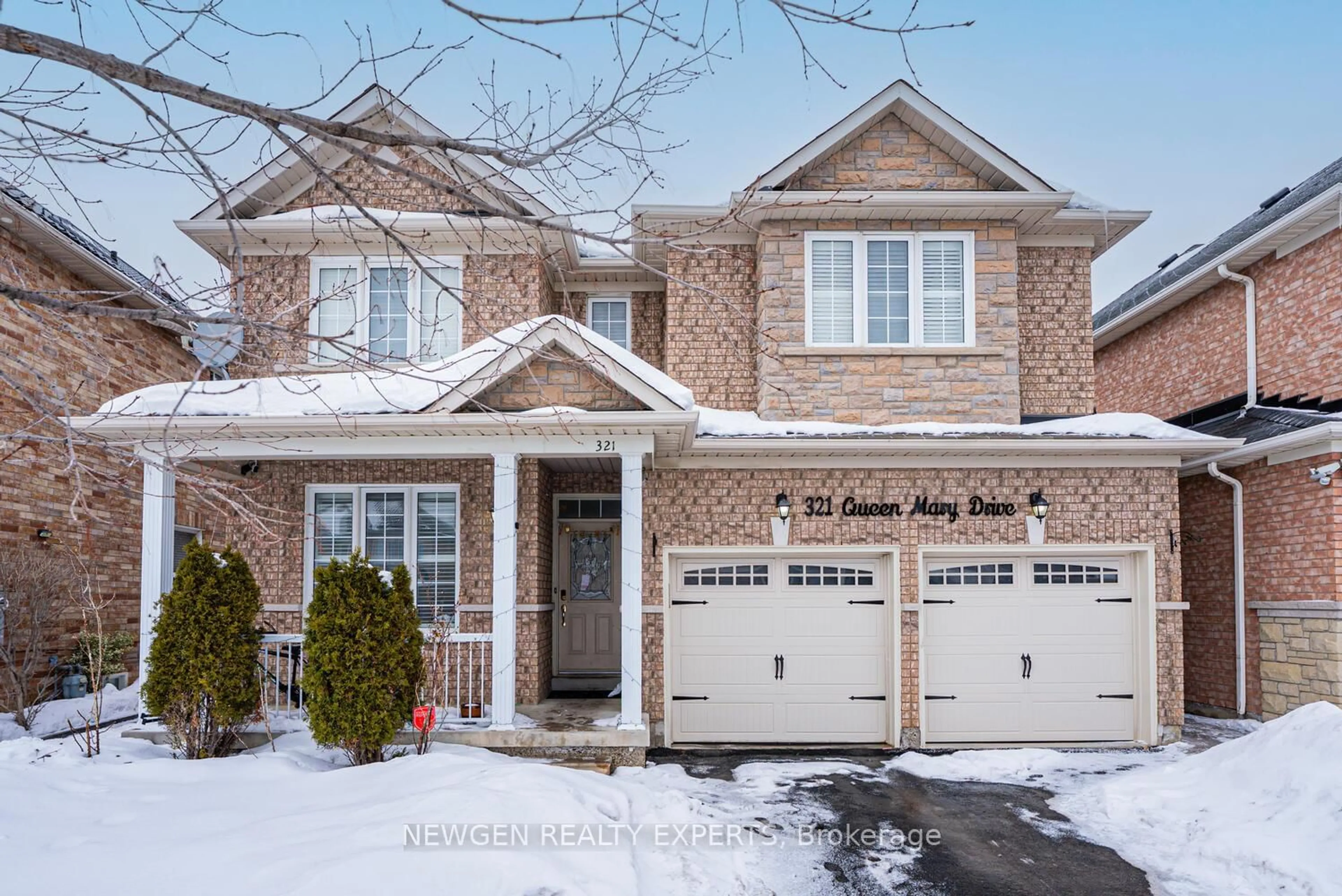 Home with brick exterior material, street for 321 Queen Mary Dr, Brampton Ontario L7A 3S6