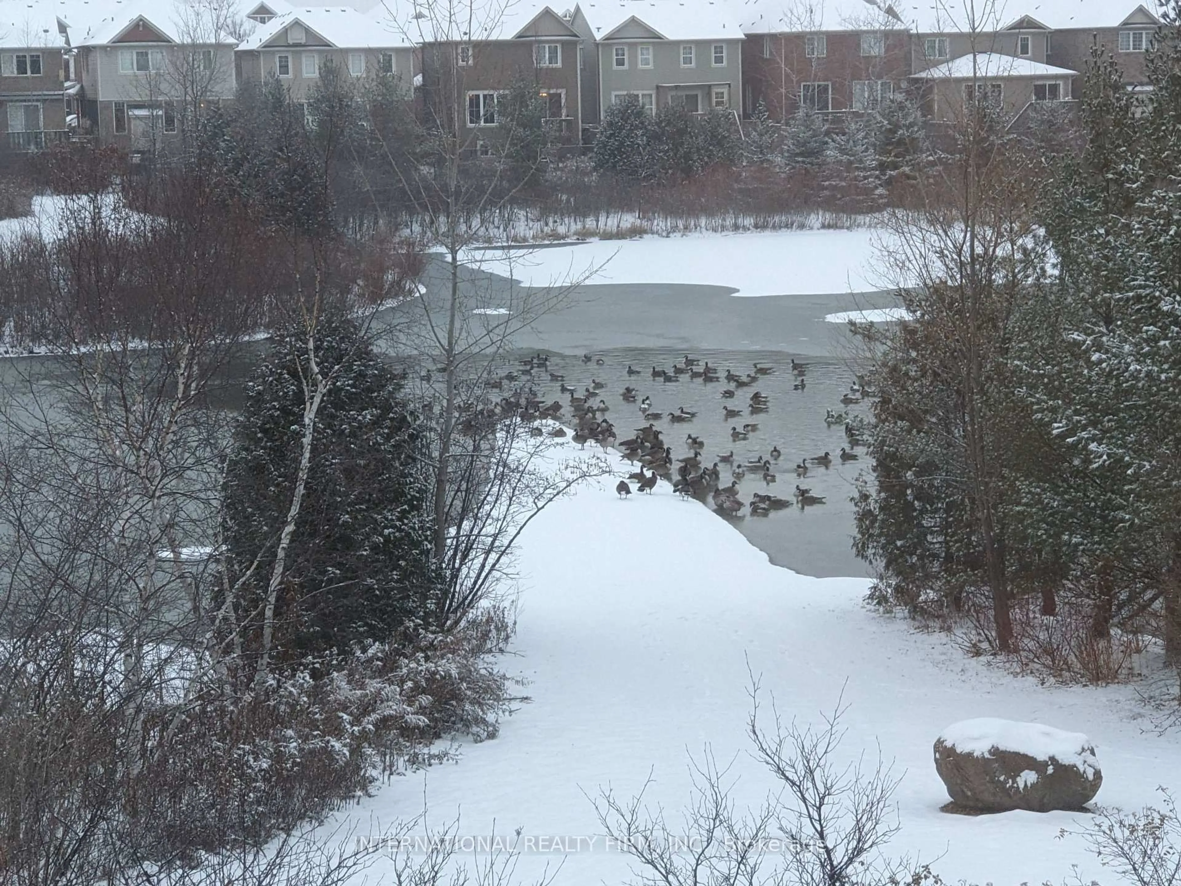 A pic from outside/outdoor area/front of a property/back of a property/a pic from drone, water/lake/river/ocean view for 1011 Leger Way, Milton Ontario L9T 8B4