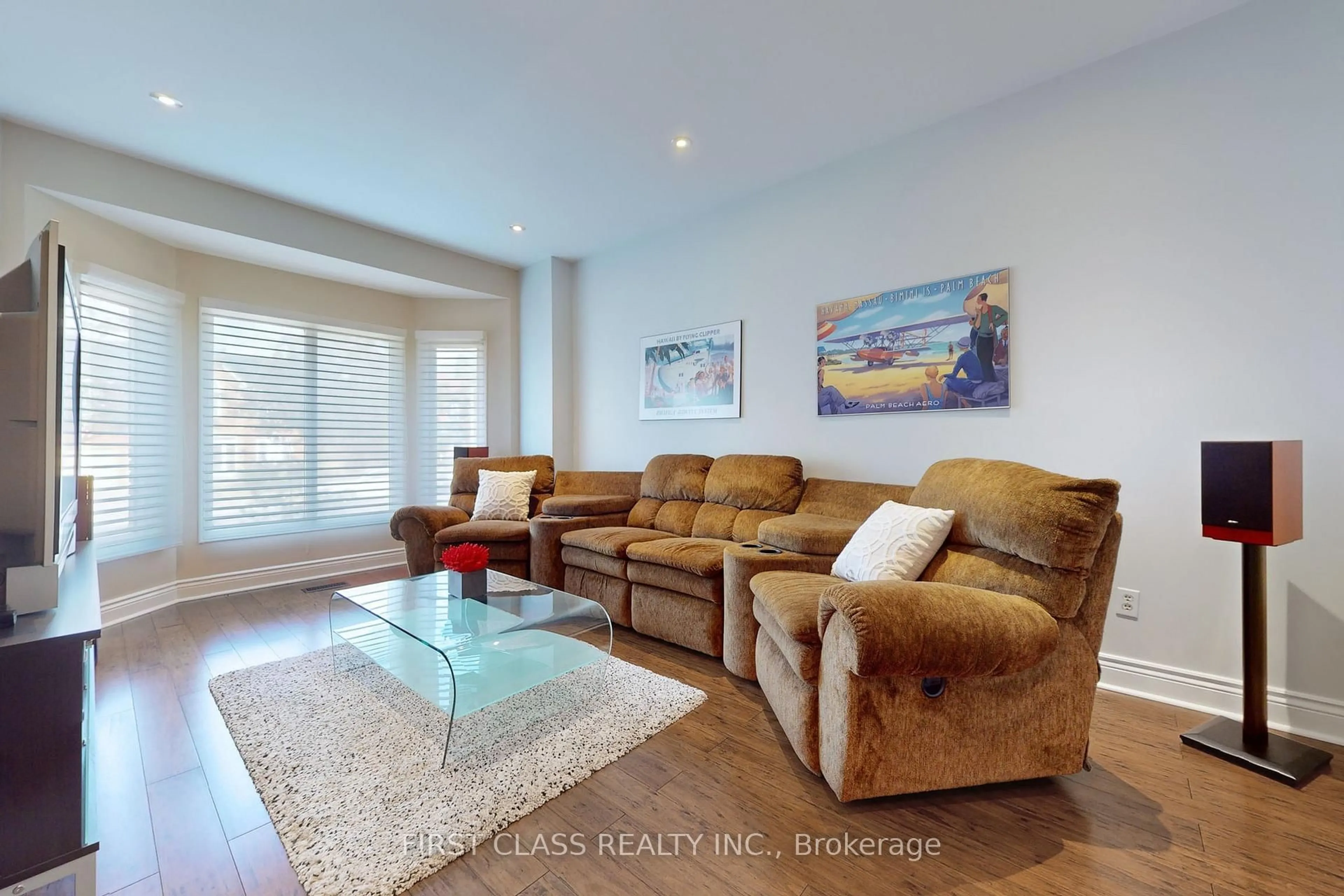 Living room with furniture, wood/laminate floor for 7 Kenpark Ave, Brampton Ontario L6Z 3P4