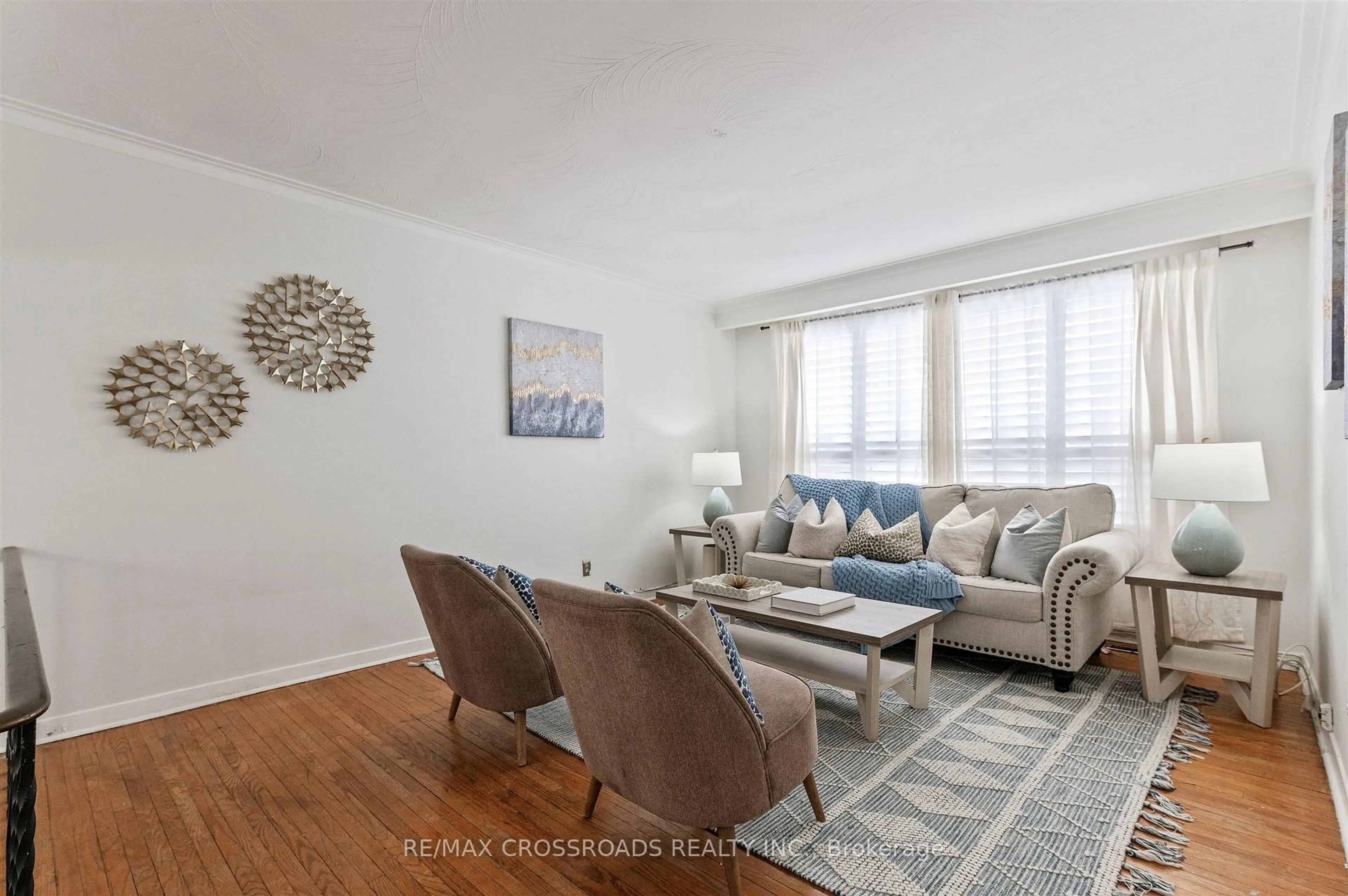 Living room with furniture, wood/laminate floor for 98 Willowridge Rd, Toronto Ontario M9R 3Z4