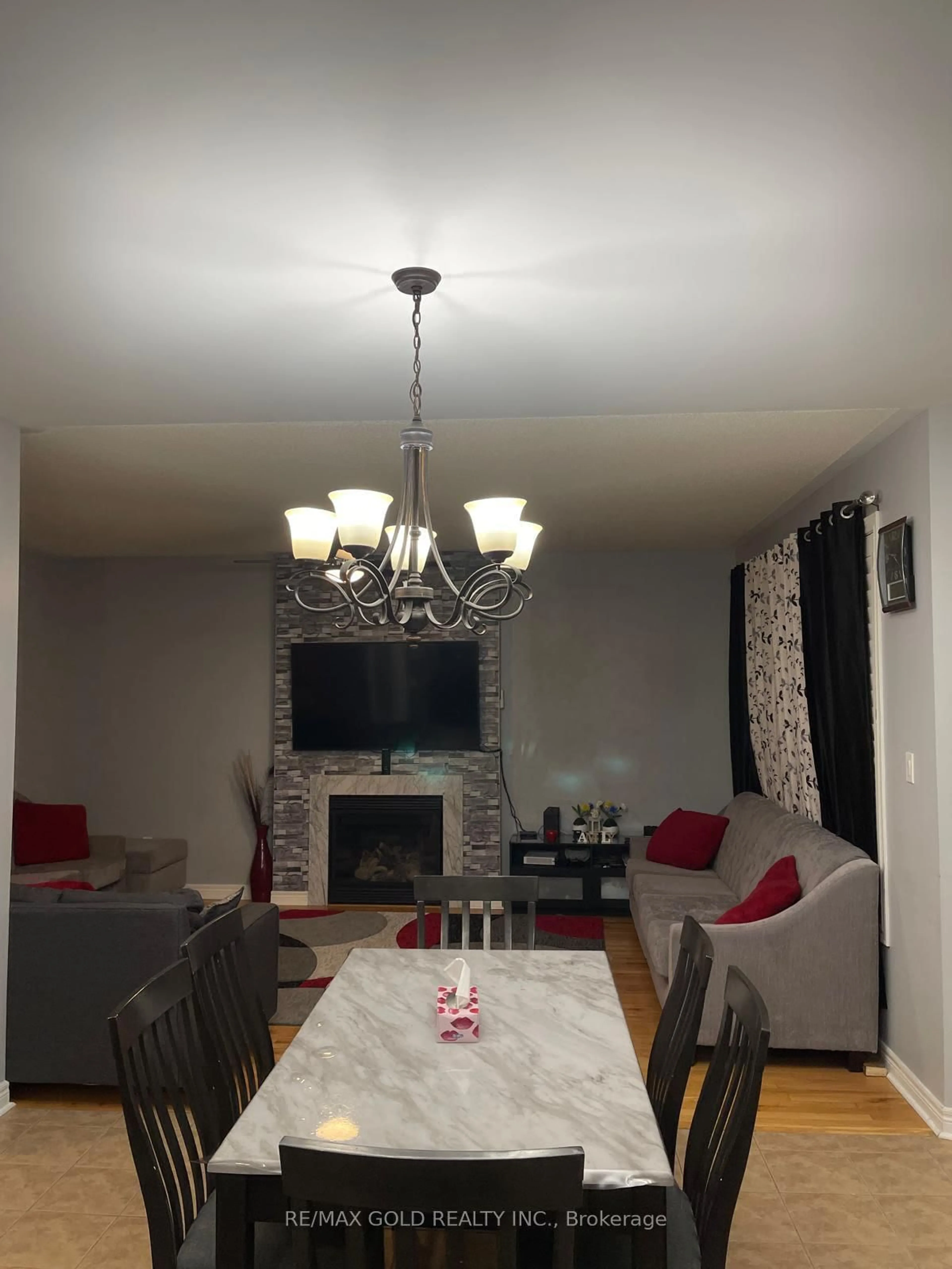 Living room with furniture, wood/laminate floor for 54 Covebank Cres, Brampton Ontario L6P 2Y1