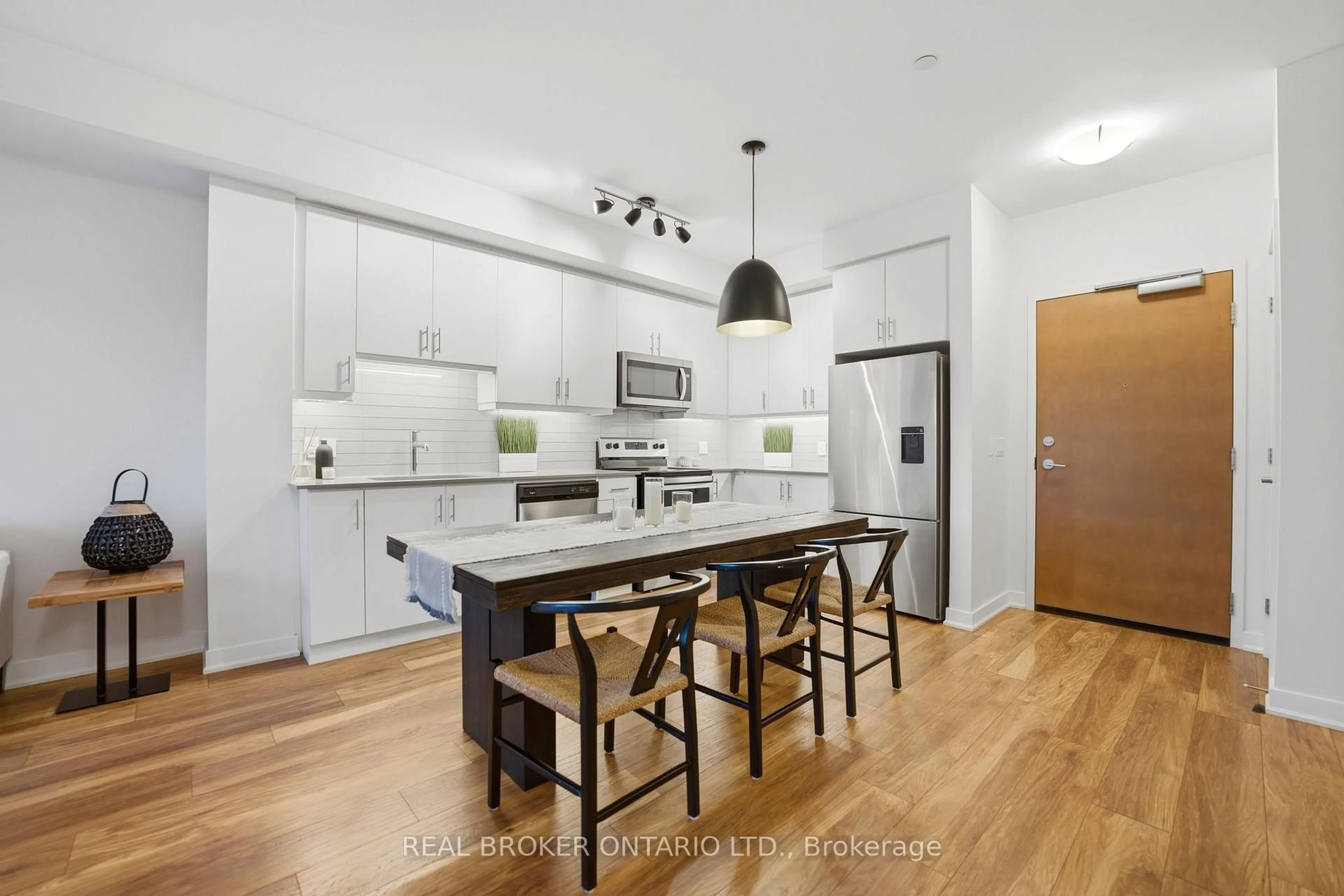 Open concept kitchen, wood/laminate floor for 320 Plains Rd #513, Burlington Ontario L7T 0C1