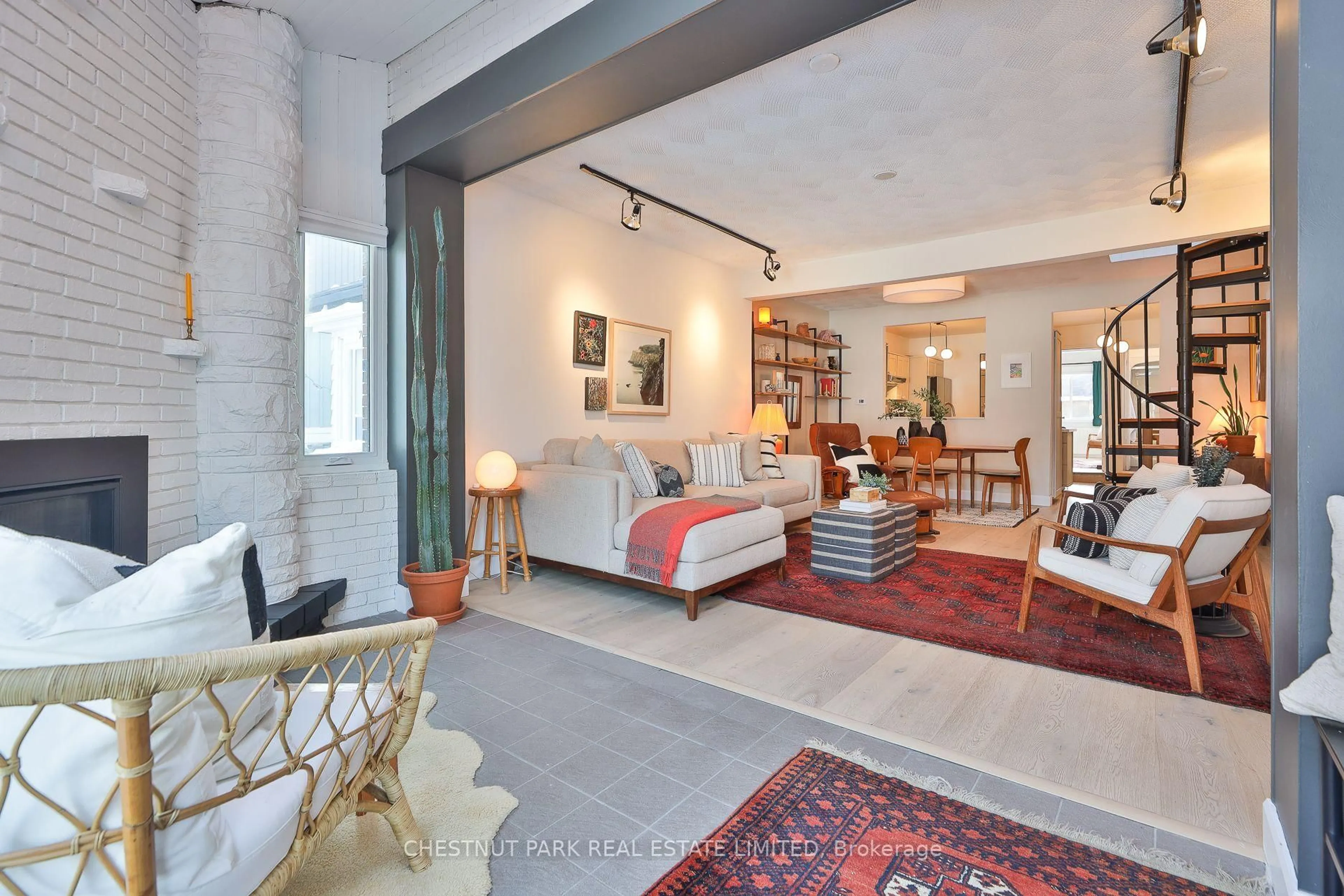 Living room with furniture, cement floor for 72 Watson Ave, Toronto Ontario M6S 4E1