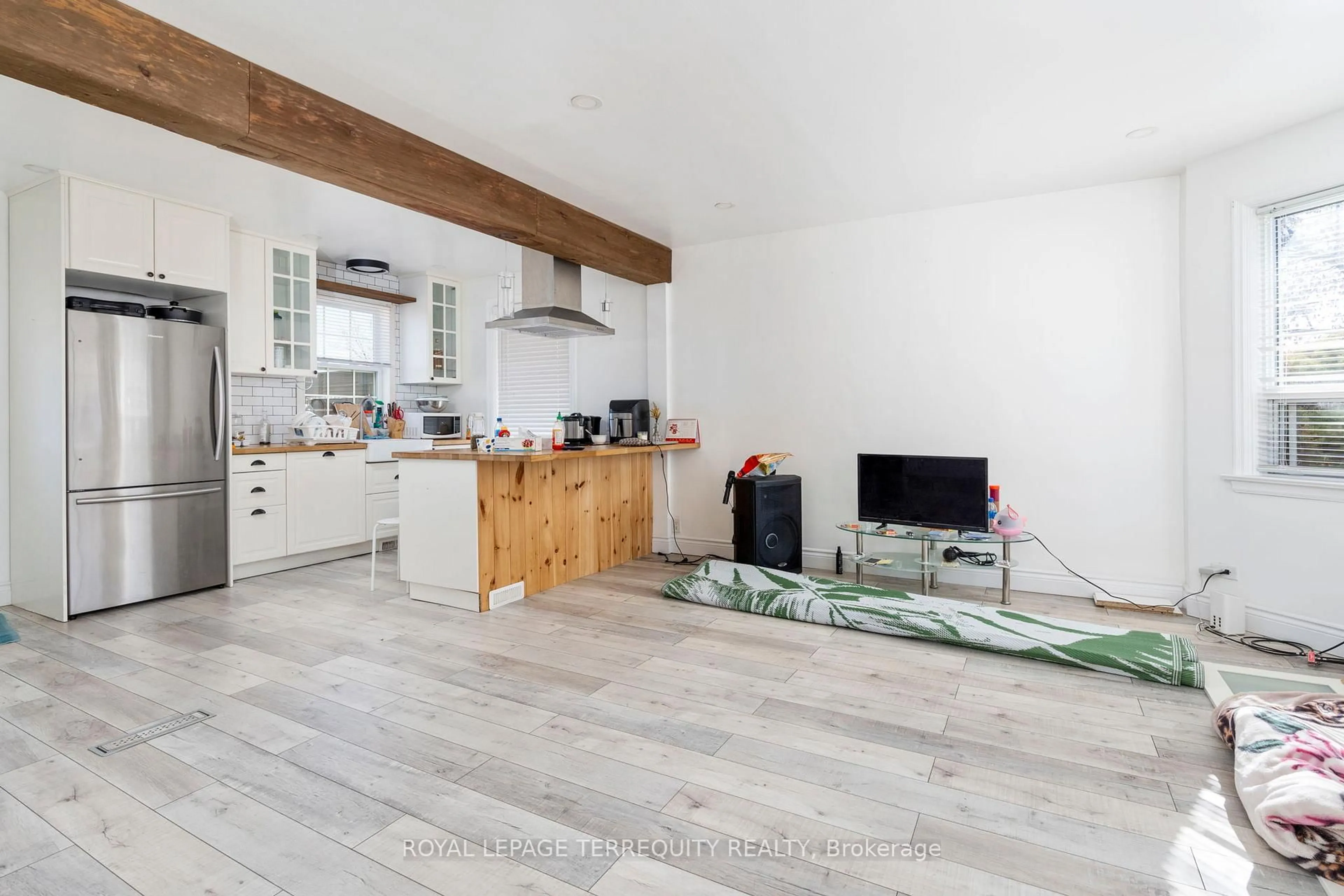 Open concept kitchen, wood/laminate floor for 64 Pelmo Cres, Toronto Ontario M9N 2X5