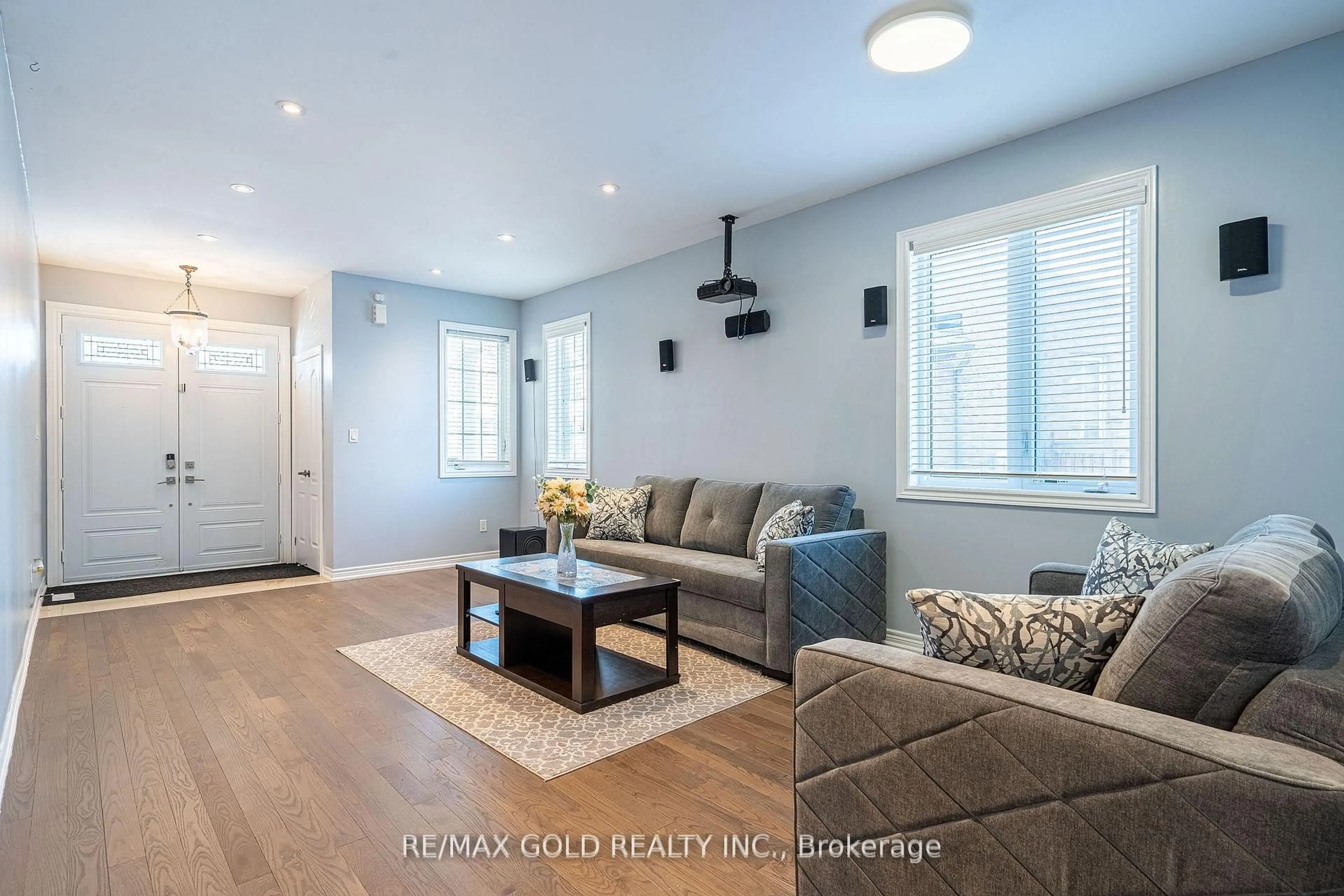 Living room with furniture, wood/laminate floor for 10 Spokanne St, Brampton Ontario L6R 4A2