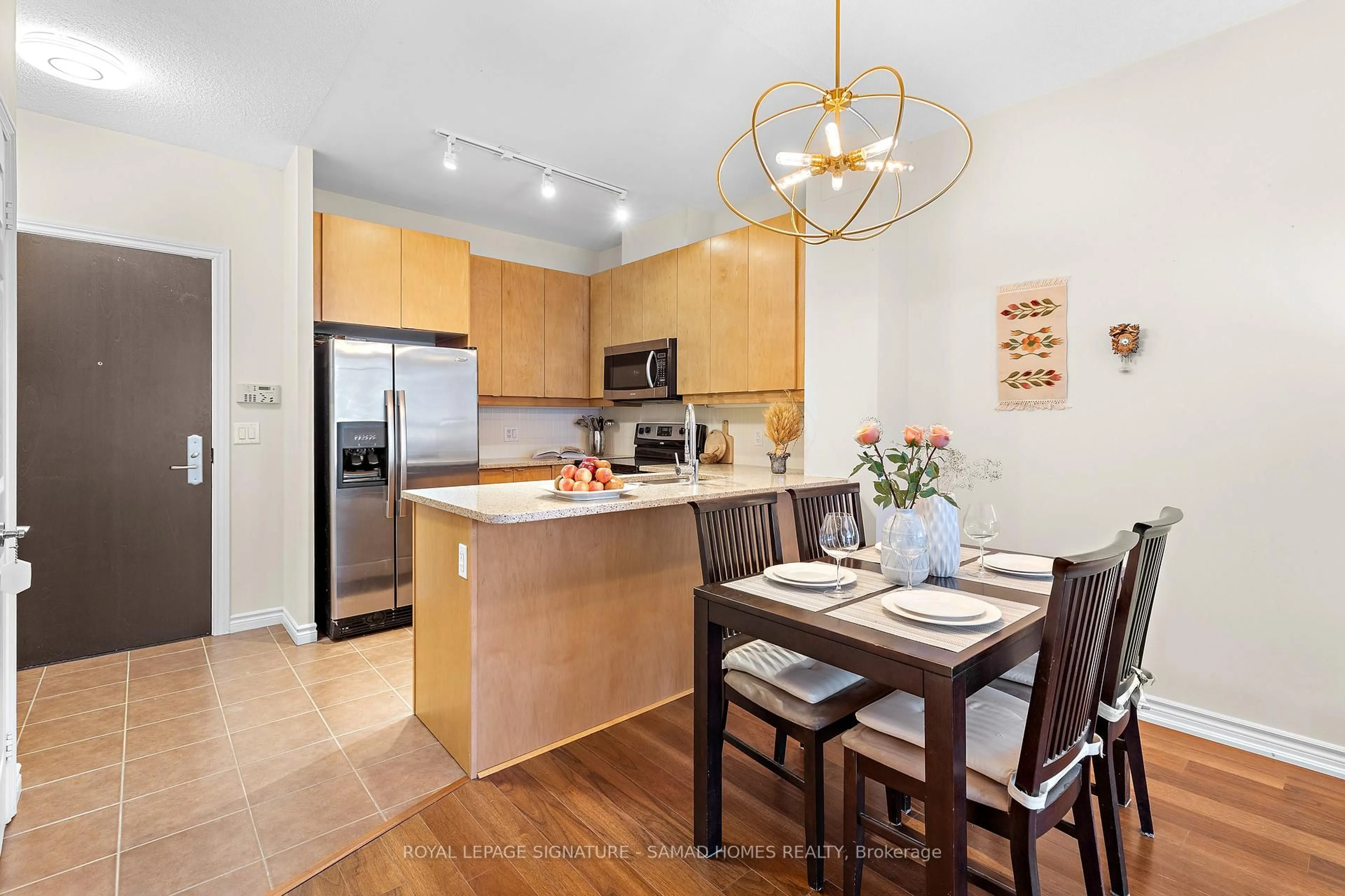 Open concept kitchen, wood/laminate floor for 1135 Royal York Rd #215, Toronto Ontario M9A 0C3