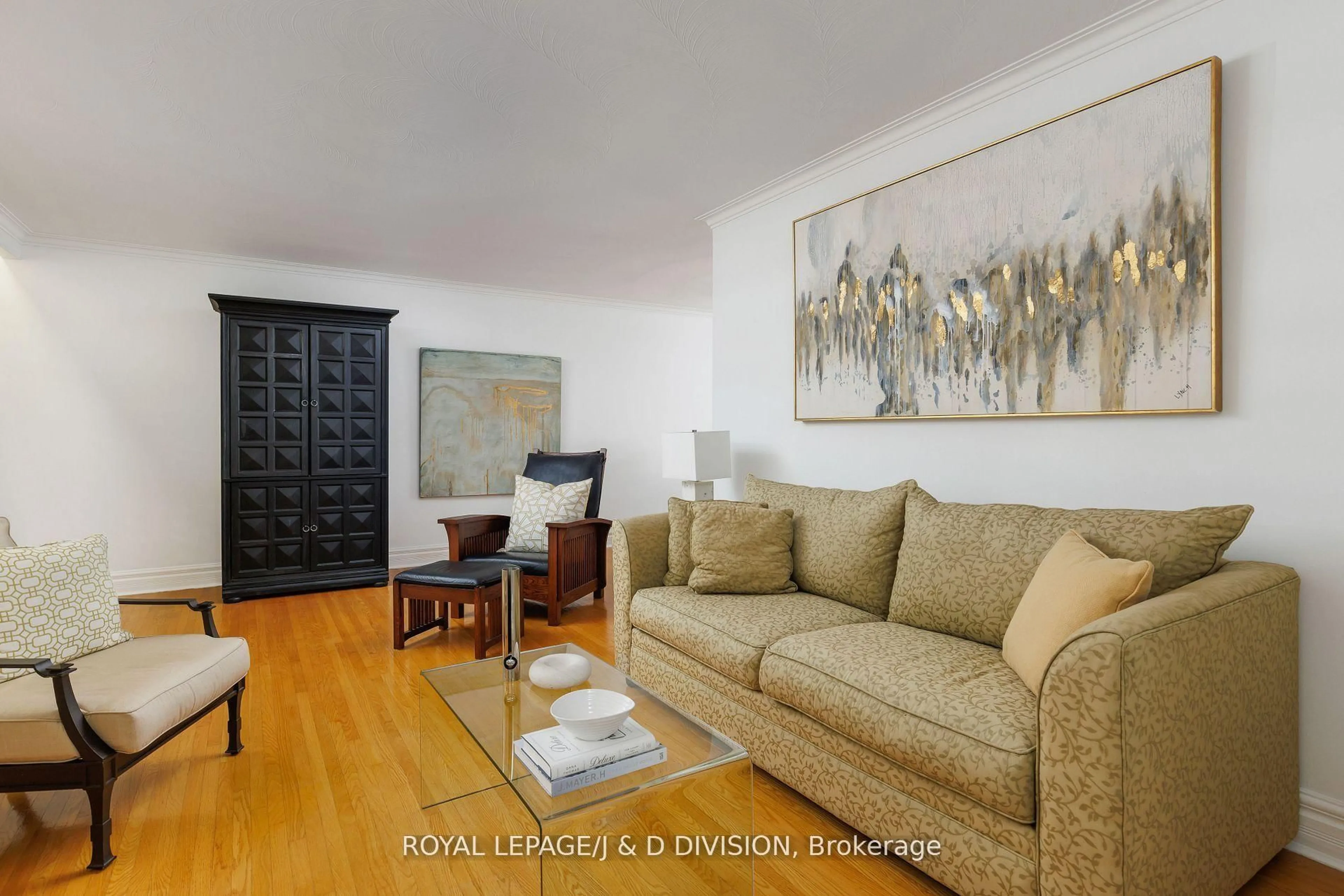 Living room with furniture, wood/laminate floor for 27 Paramount Crt, Toronto Ontario M6M 2L3