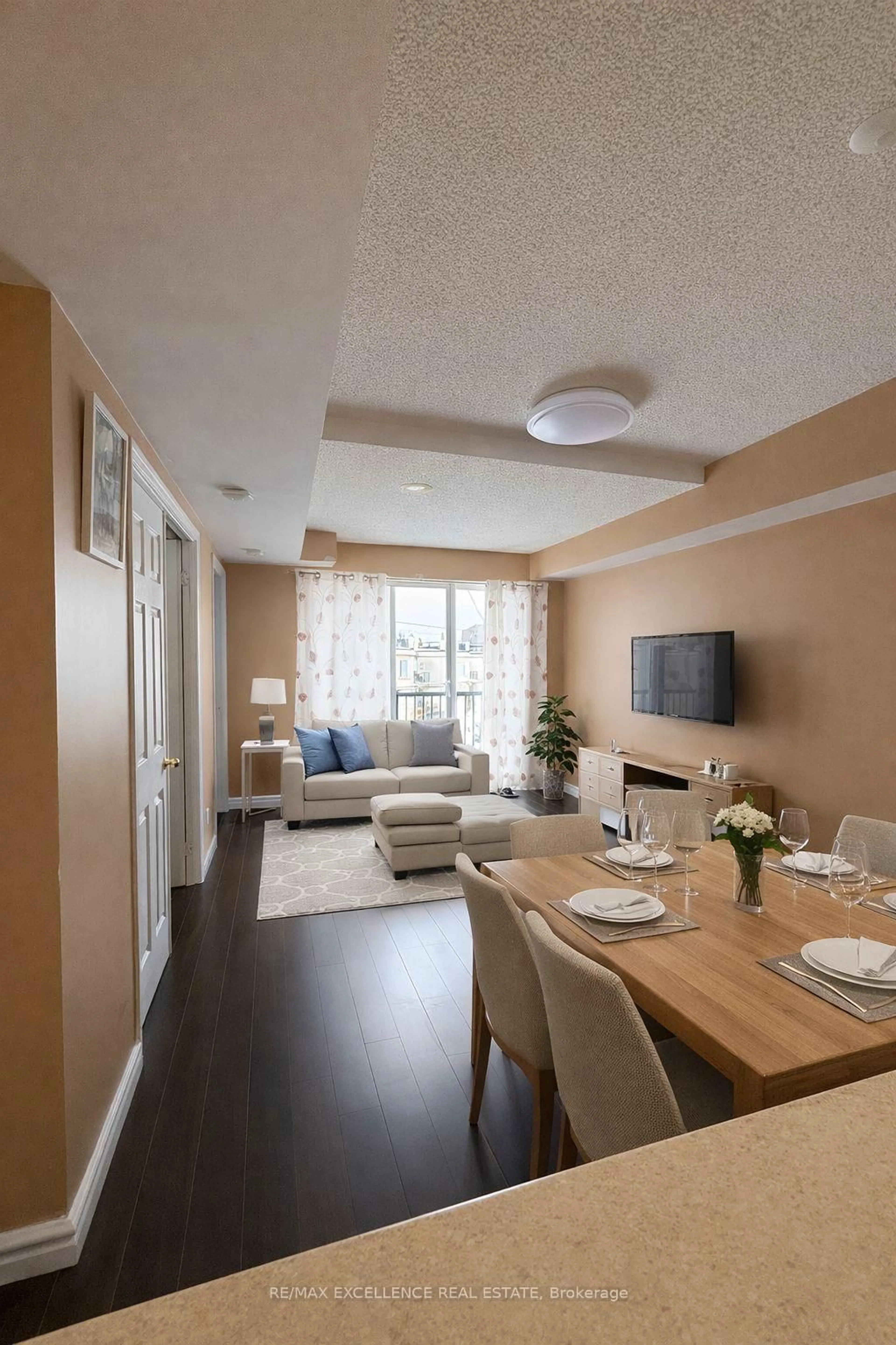 Living room with furniture, wood/laminate floor for 3043 Finch Ave #2033, Toronto Ontario M9M 0A4