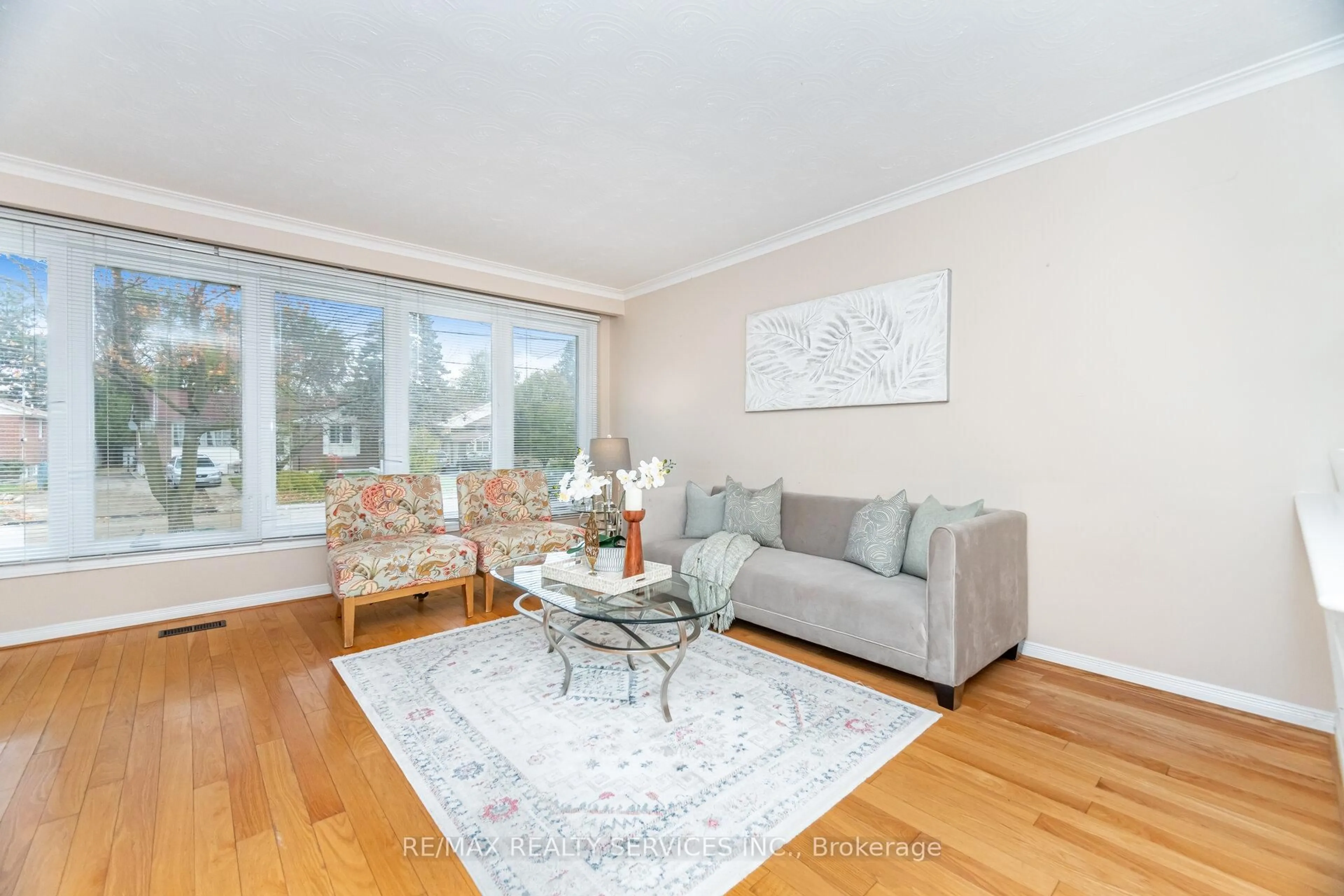 Living room with furniture, wood/laminate floor for 41 Kimbark Dr, Brampton Ontario L6X 2A3