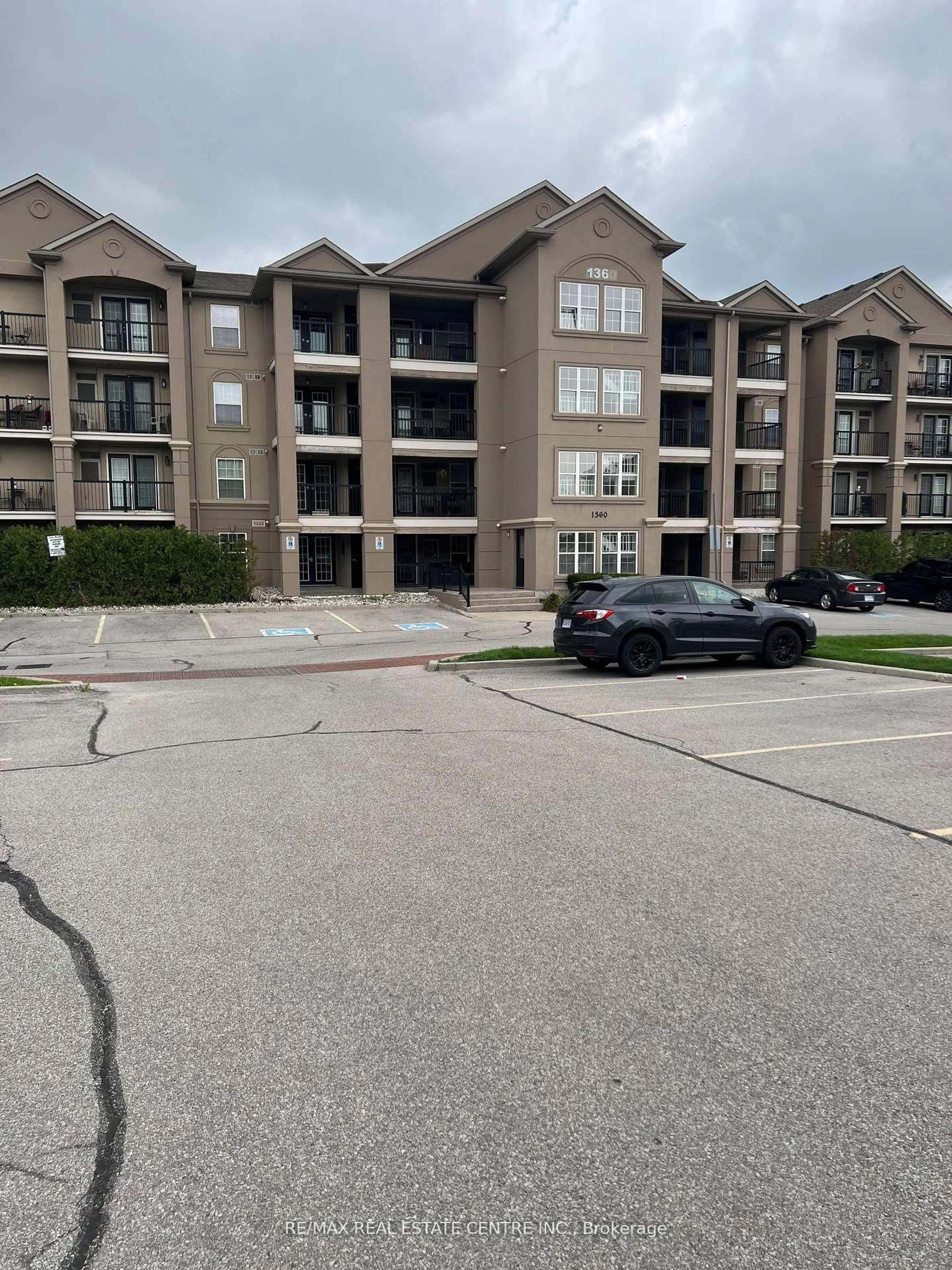 A pic from outside/outdoor area/front of a property/back of a property/a pic from drone, unknown for 1360 Main St #409, Milton Ontario L9T 7S5
