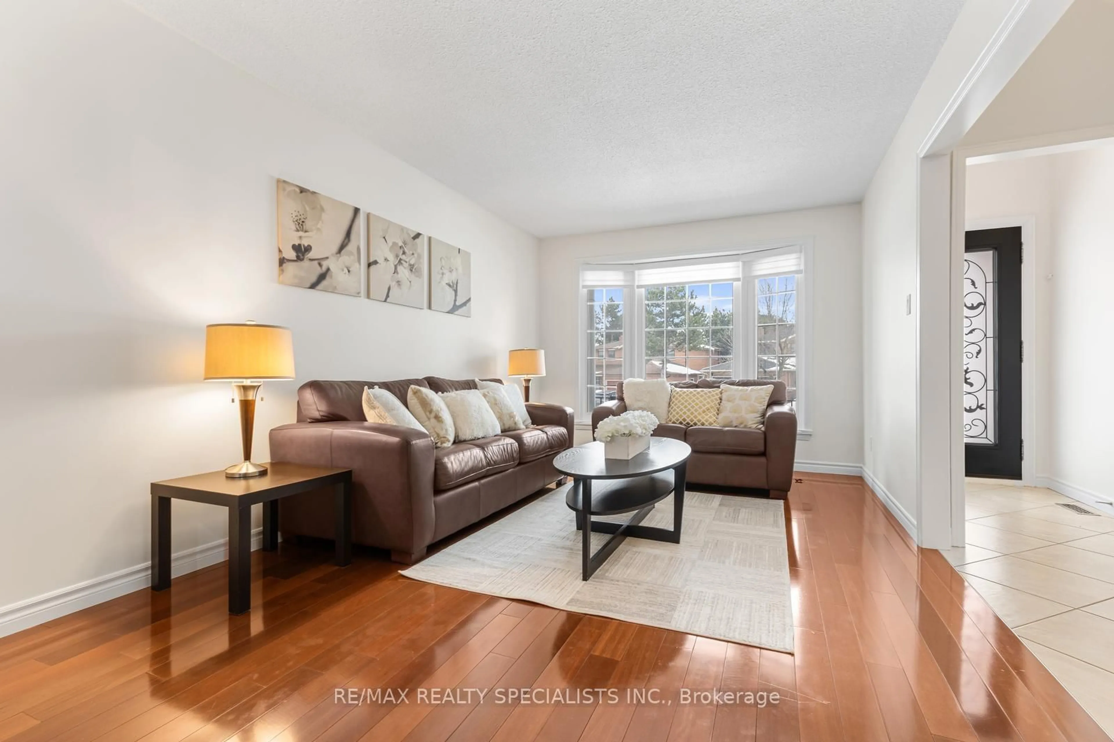 Living room with furniture, wood/laminate floor for 100 Princeton Terr, Brampton Ontario L6S 3S9