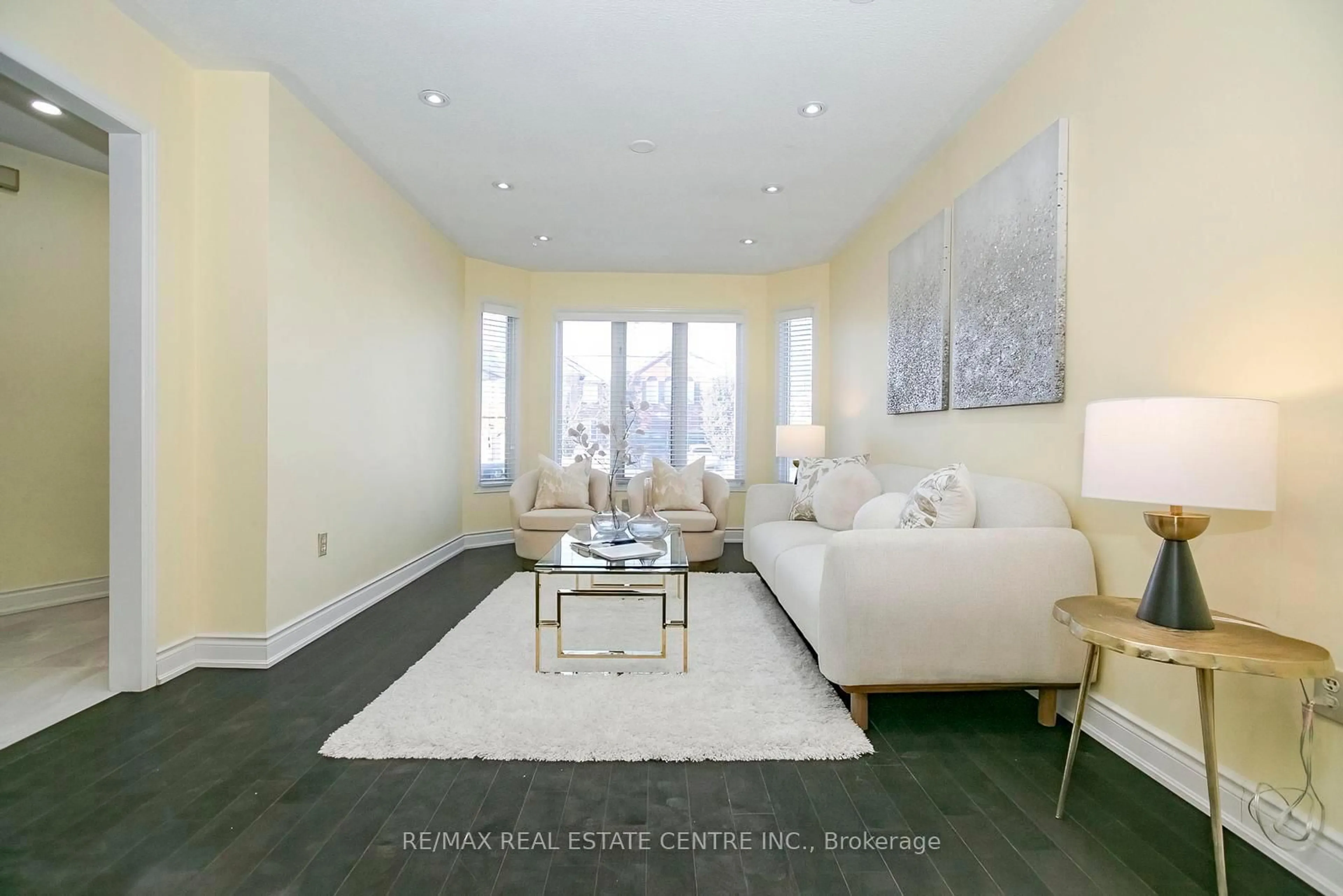 Living room with furniture, ceramic/tile floor for 37 Duggan Dr, Brampton Ontario L6Y 4J2