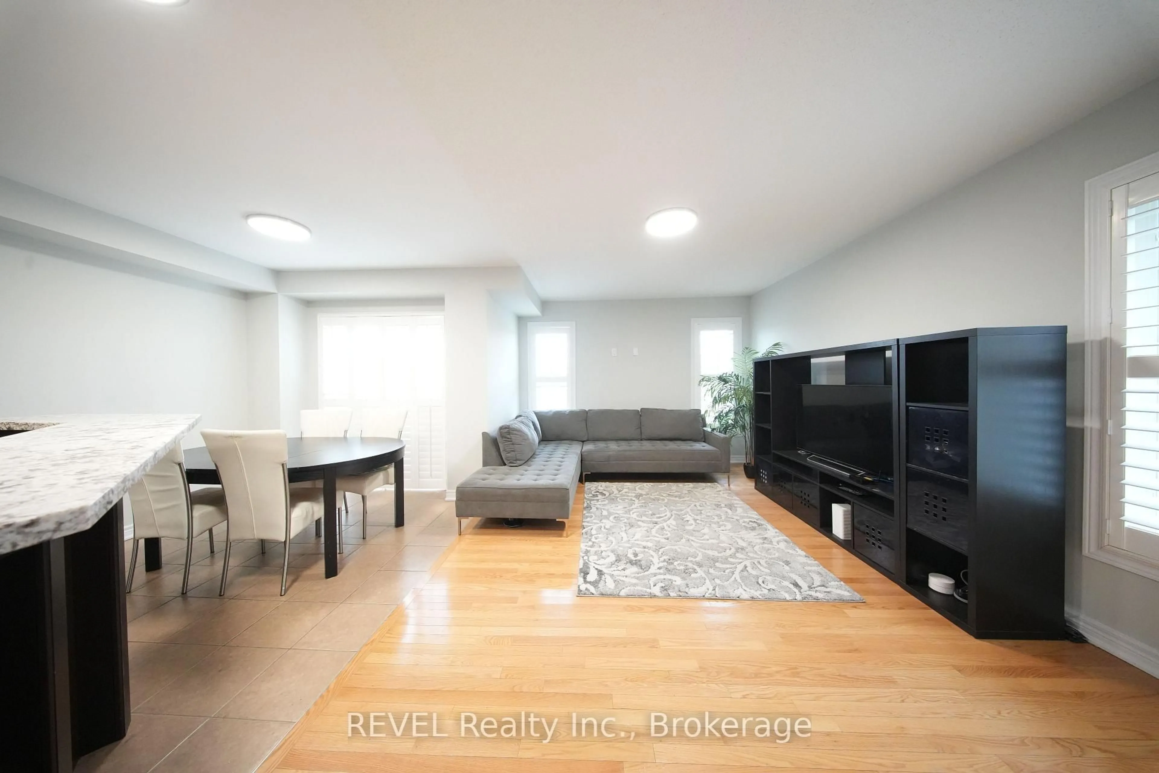 Living room with furniture, wood/laminate floor for 97 Cedarbrook Rd, Brampton Ontario L6R 0W4