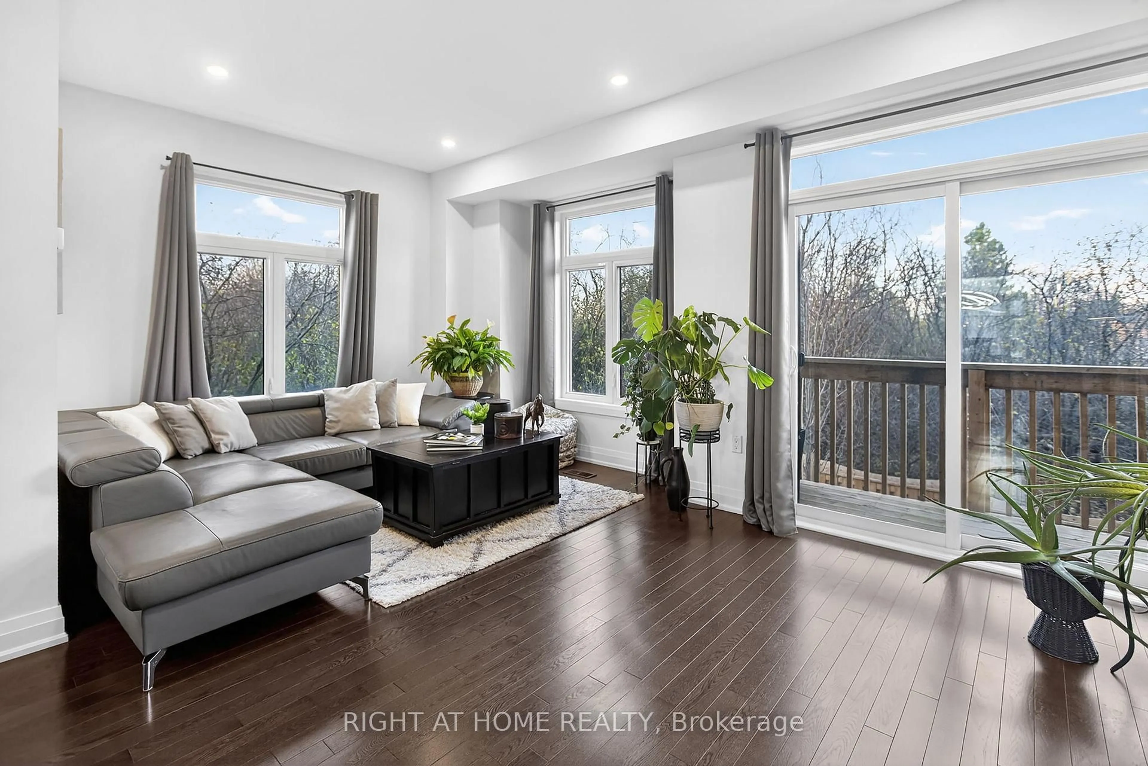 Living room with furniture, wood/laminate floor for 1802 Mitoff Pl, Mississauga Ontario L4W 0E8