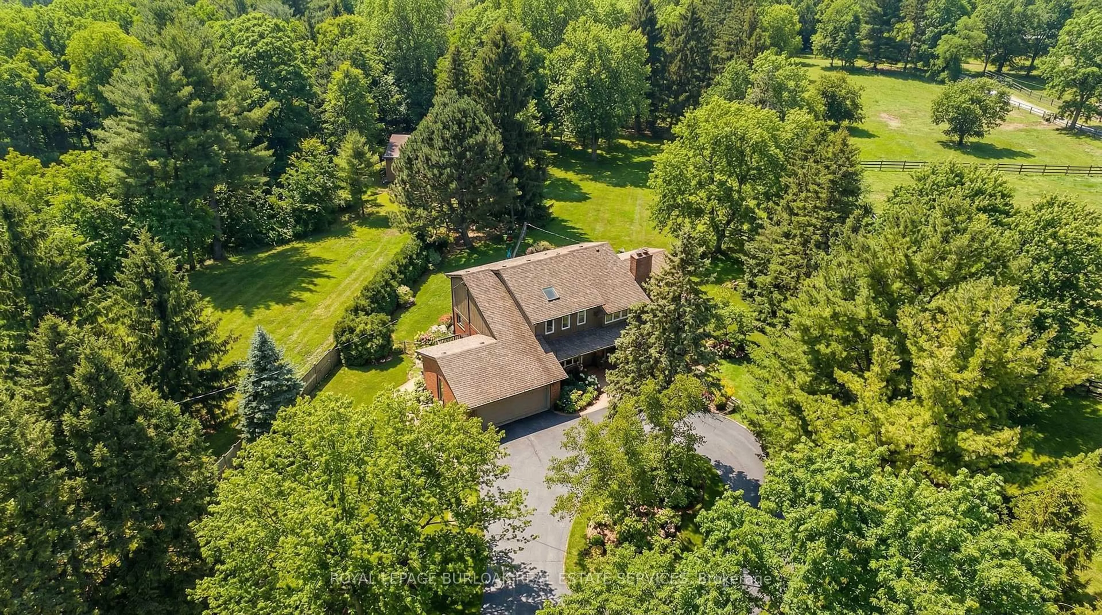 A pic from outside/outdoor area/front of a property/back of a property/a pic from drone, forest/trees view for 2431 Britannia Rd, Burlington Ontario L7P 0E9