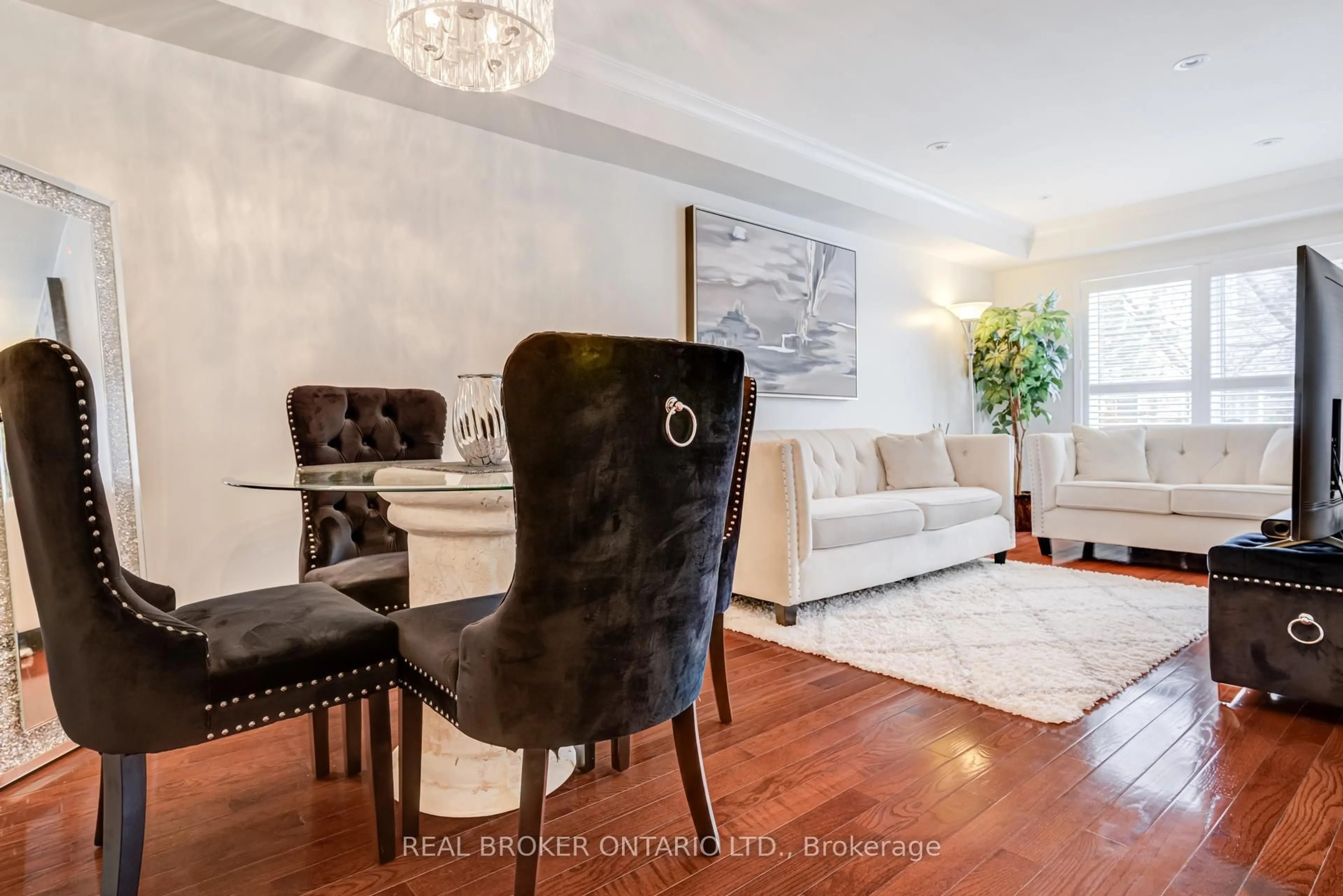 Living room with furniture, wood/laminate floor for 86 Joymar Dr #102, Mississauga Ontario L5M 7Z6