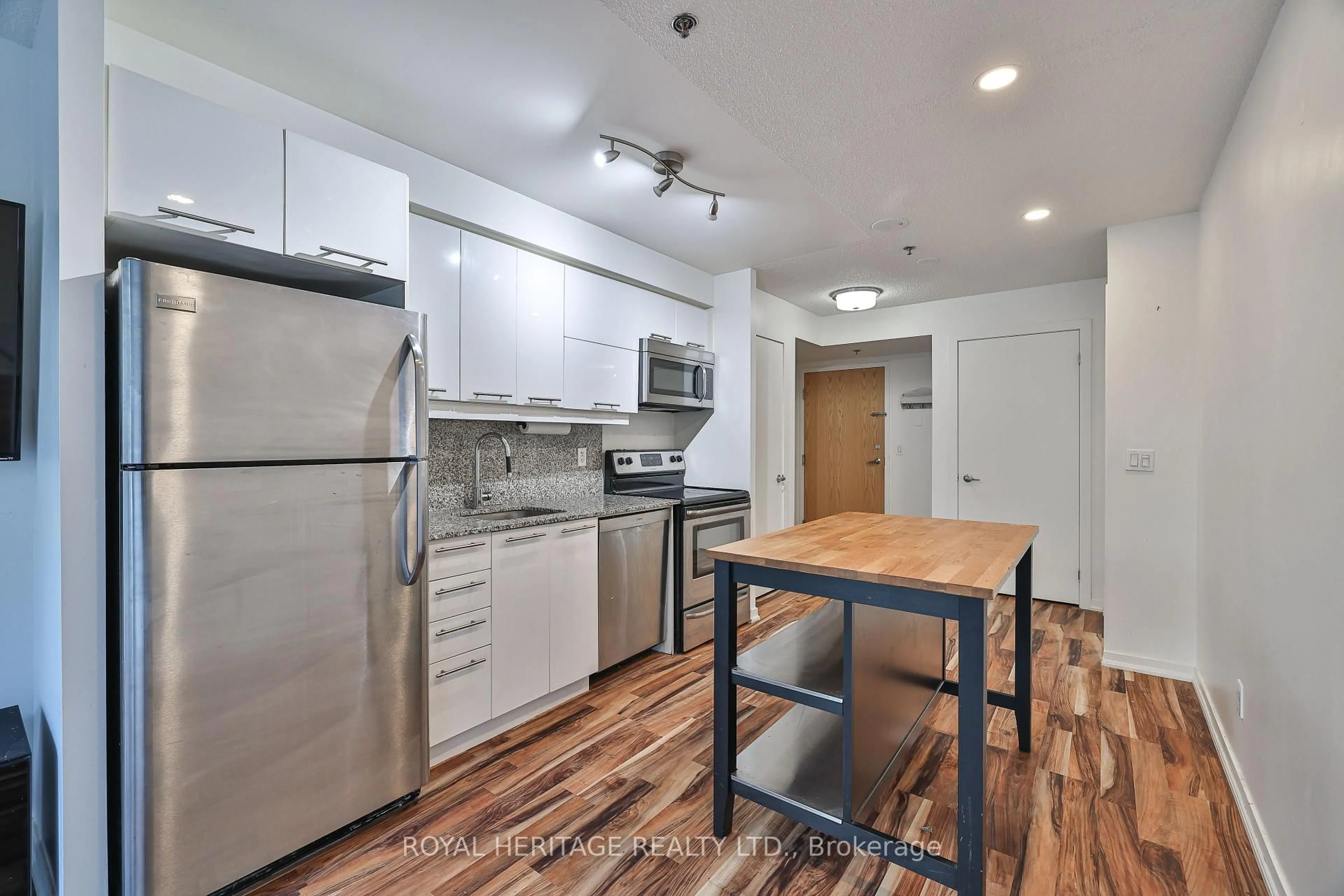 Standard kitchen, wood/laminate floor for 38 Joe Shuster Way #104, Toronto Ontario M6K 0A5