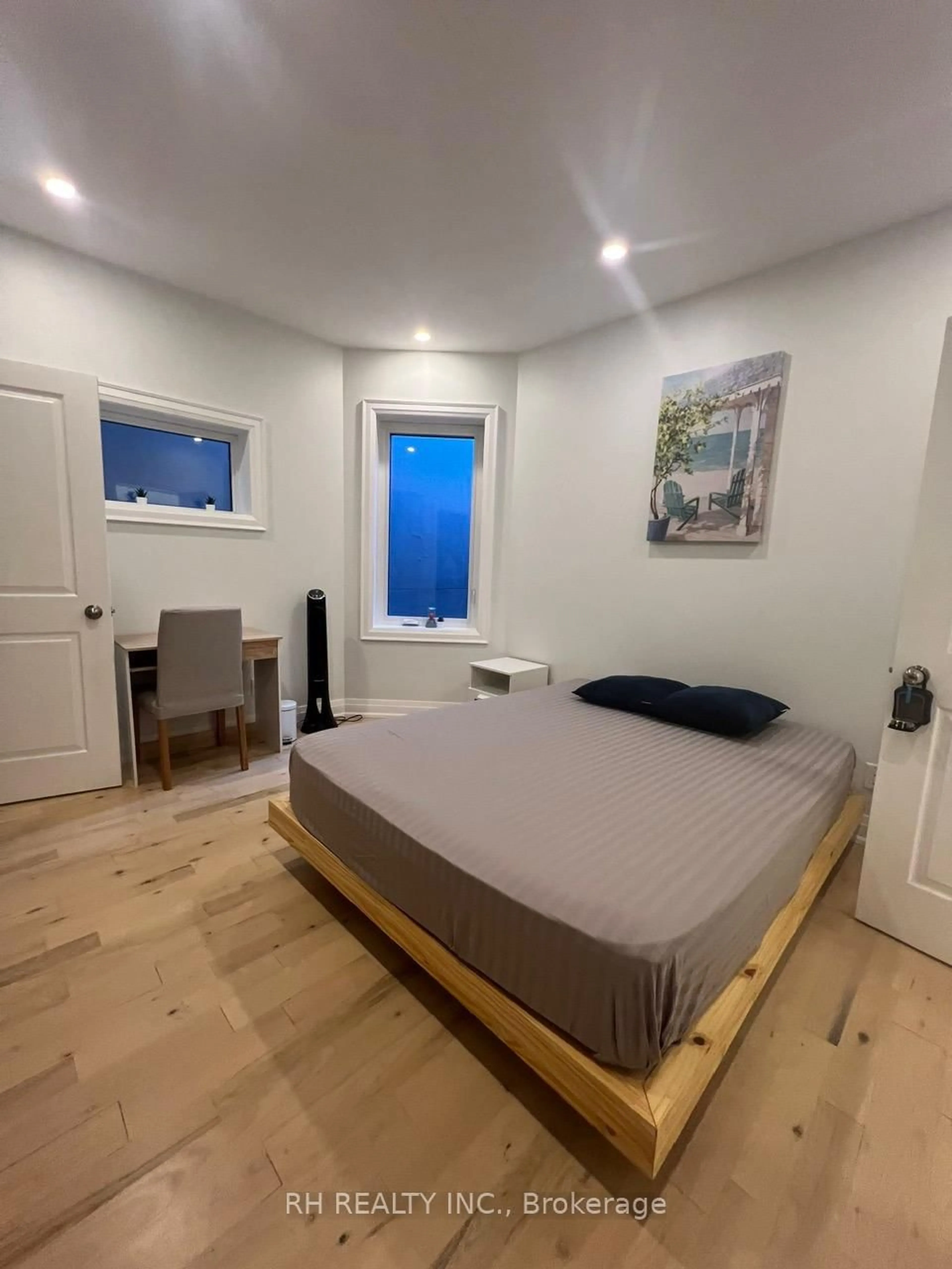 Bedroom with bed, wood/laminate floor for 19 Wade Ave, Toronto Ontario M6H 1P4