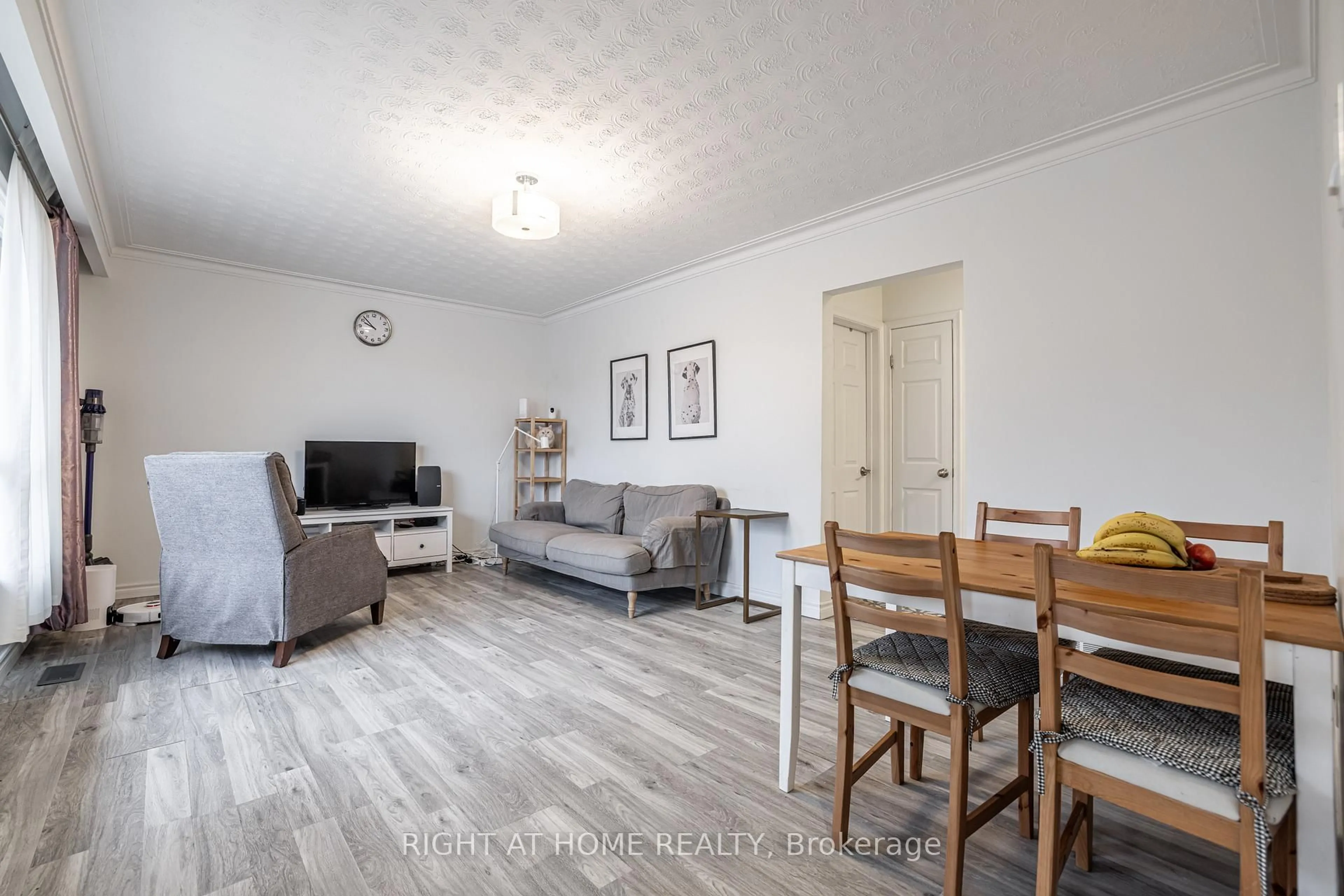Living room with furniture, wood/laminate floor for 2076 Constance Dr, Oakville Ontario L6J 2V7