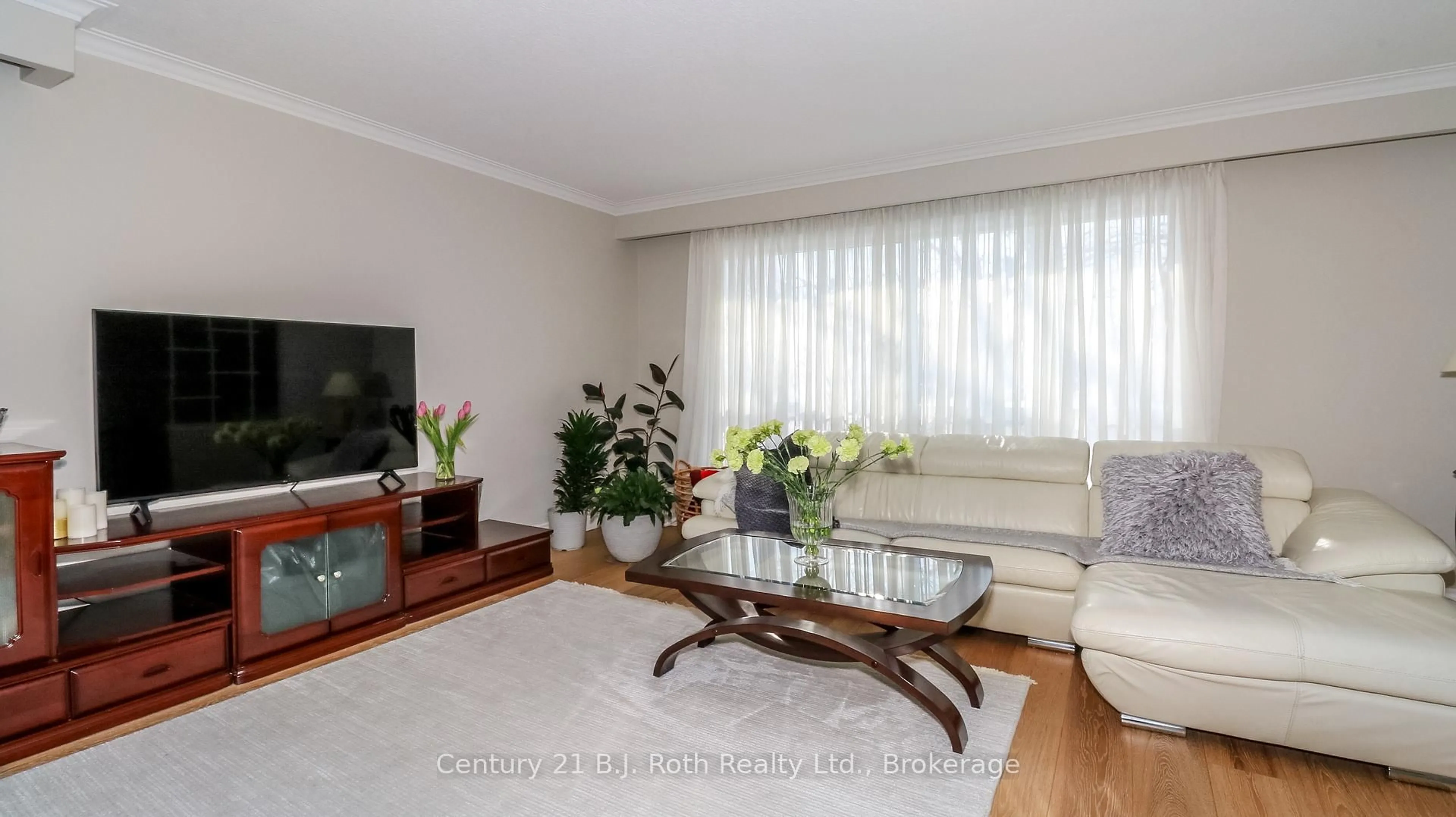 Living room with furniture, wood/laminate floor for 156 The Westway, Toronto Ontario M9P 2C1