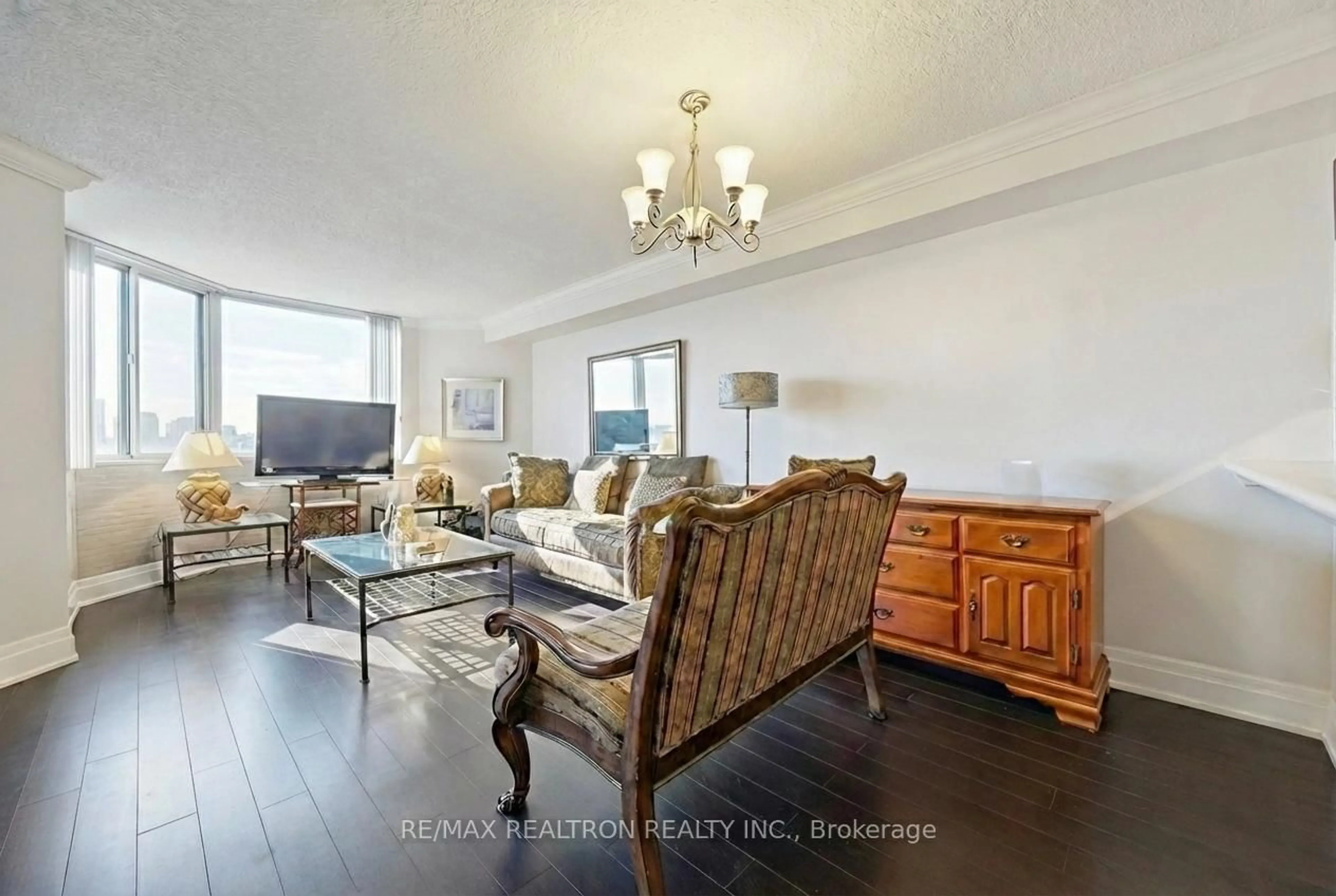 Living room with furniture, wood/laminate floor for 236 Albion Rd #903, Toronto Ontario M9W 6A6