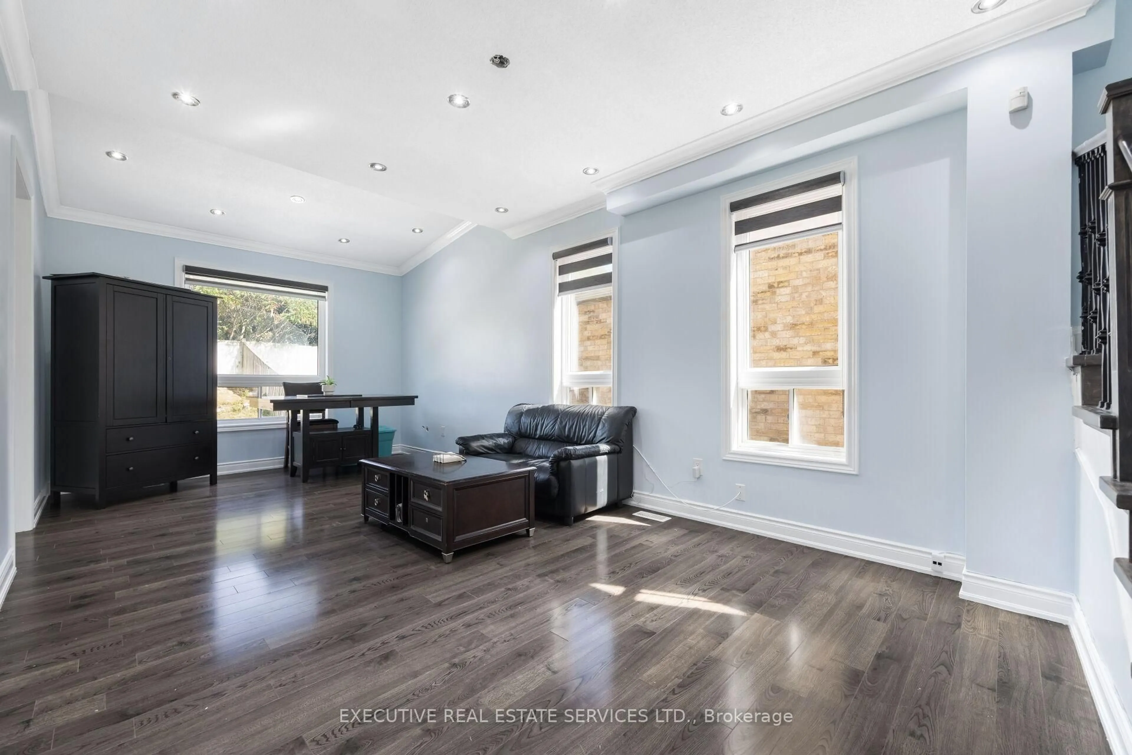 Living room with furniture, wood/laminate floor for 43 Susan Ave, Brampton Ontario L6Y 5N5