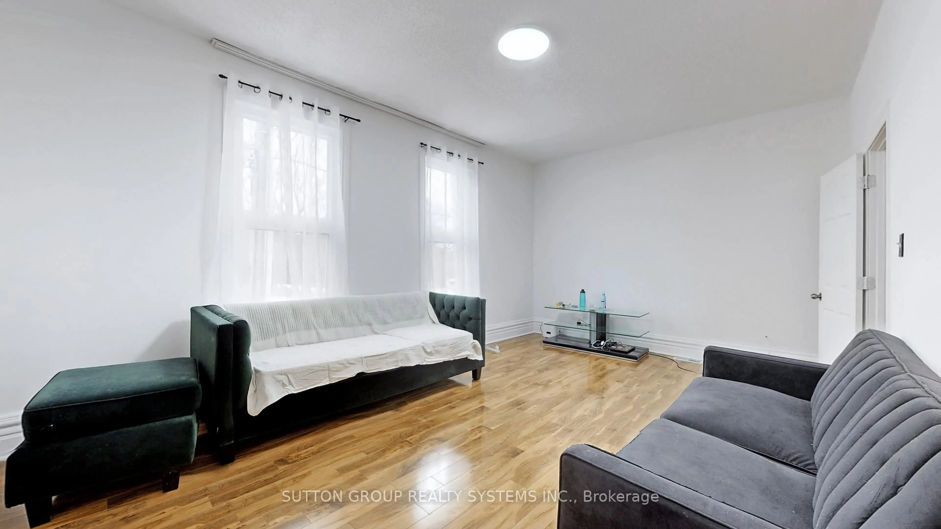 Living room with furniture, wood/laminate floor for 337 Perth Ave, Toronto Ontario M6P 3X9