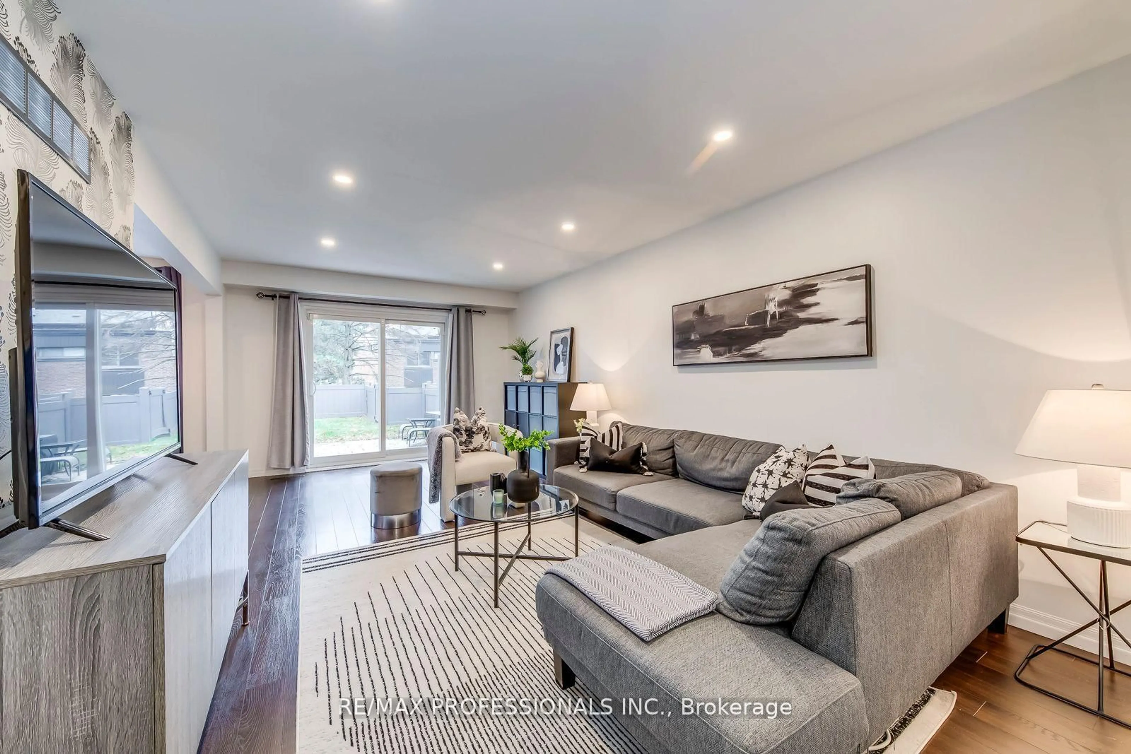 Living room with furniture, wood/laminate floor for 4345 Bloor St #51, Toronto Ontario M9C 2A4