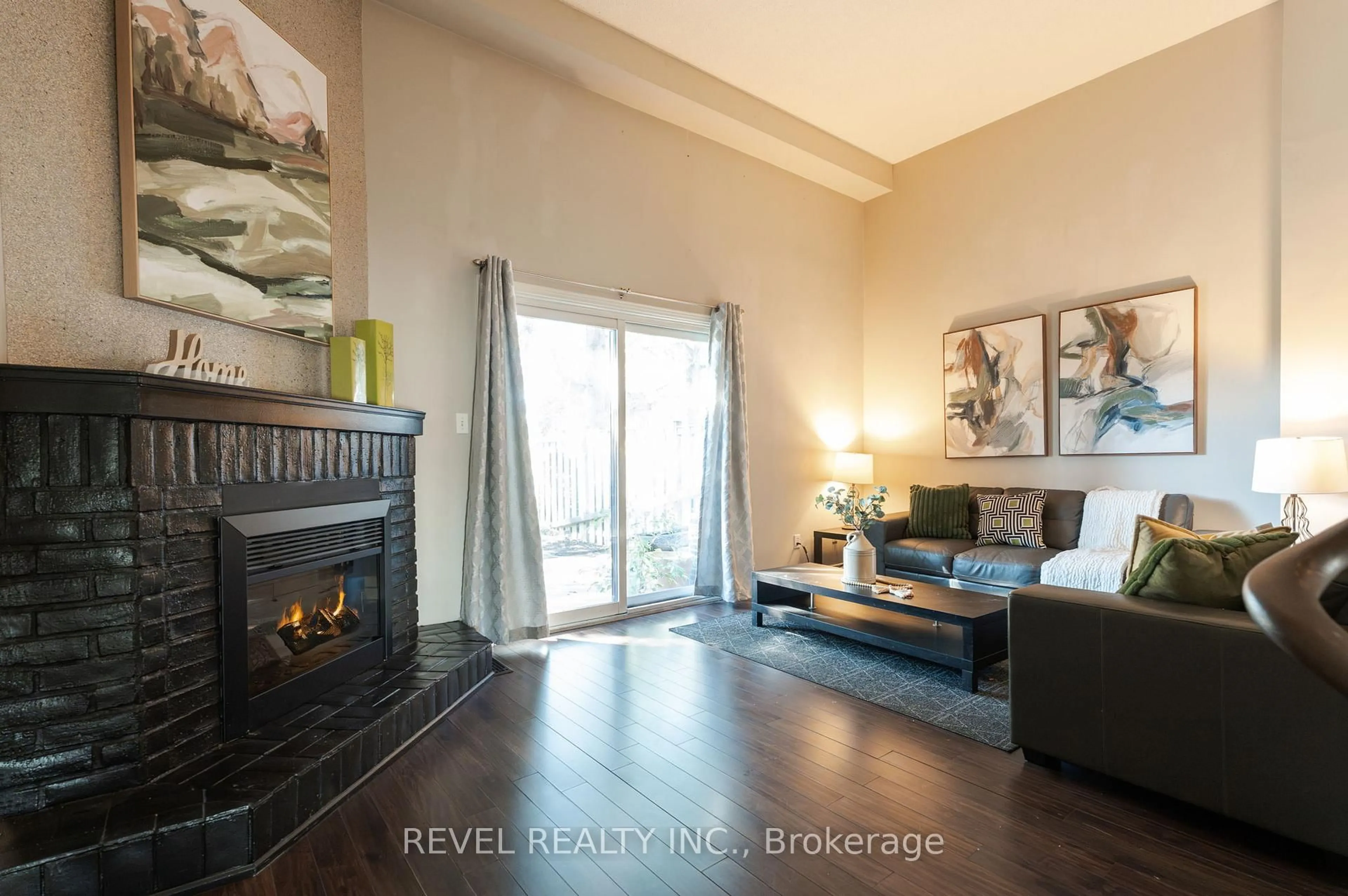 Living room with furniture, wood/laminate floor for 3360 Council Ring Rd #57, Mississauga Ontario L5L 2E4